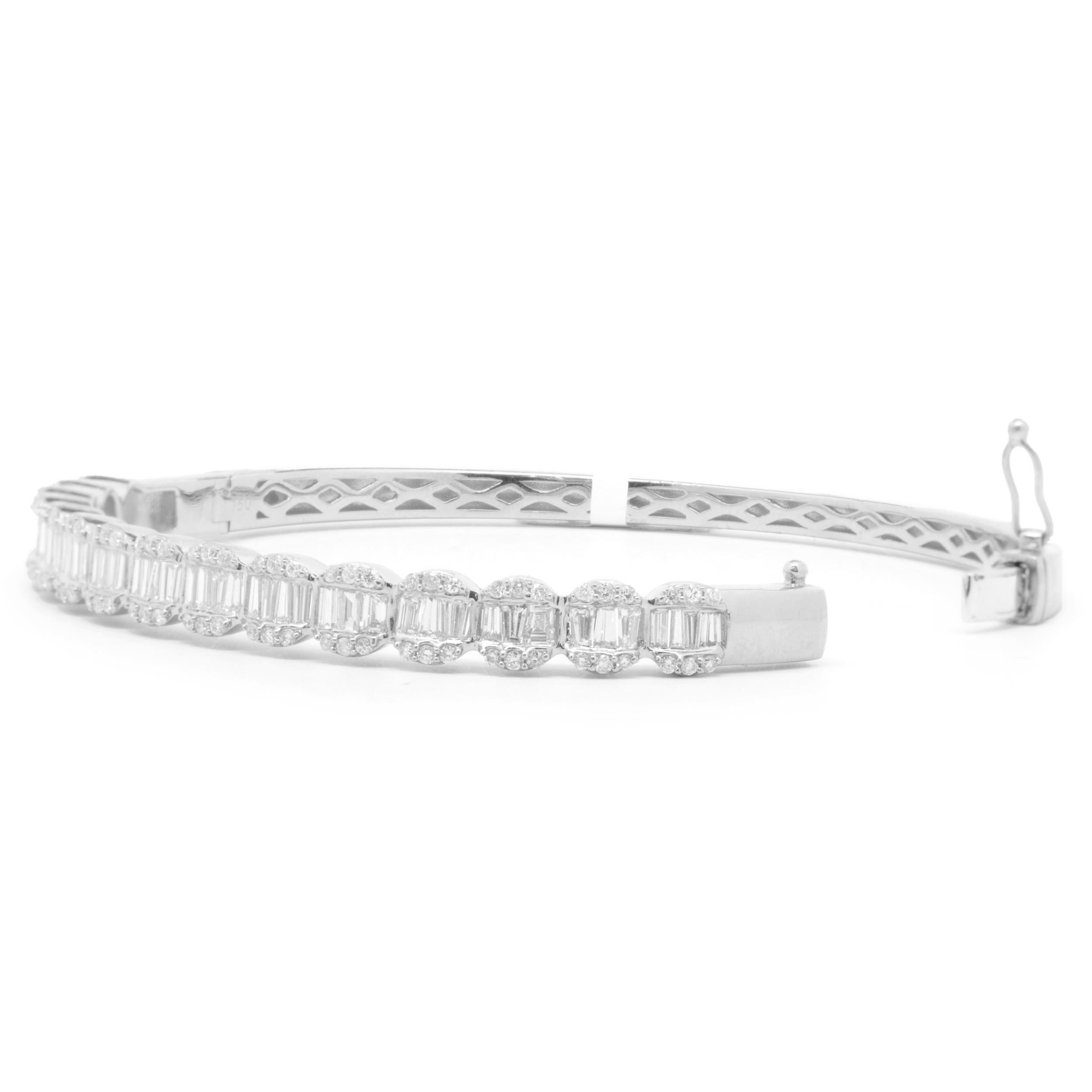 Designer: custom
Material: 18K white gold
Diamonds: 90 round brilliant cut = 0.50cttw
Color: F 
Clarity: VS2
Diamonds: 57 baguette cut = 1.80cttw
Color: F 
Clarity: VS2
Dimensions: bracelet will fit up to a 7.5-inch wrist
Weight: 18.08 grams