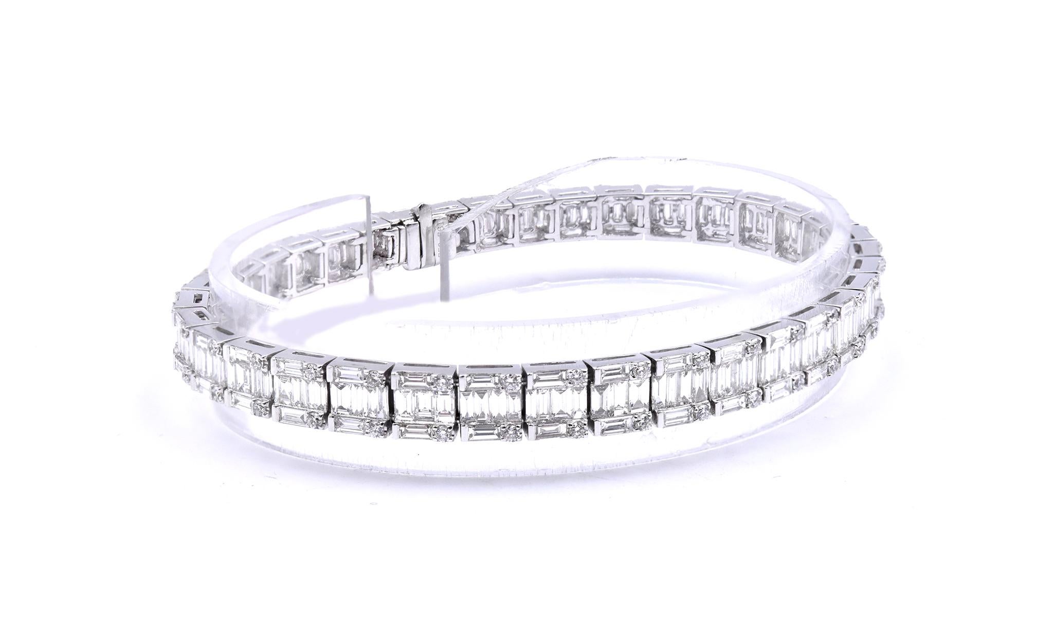 Material: 18K white gold
Diamonds: 72 round cut = .80cttw
Color: G
Clarity: VS1
Diamonds: 213 baguette cut =6.96cttw
Color:  G
Clarity: VS1
Dimensions: bracelet will fit up to a 7-inch wrist
Weight: 17.41 grams
