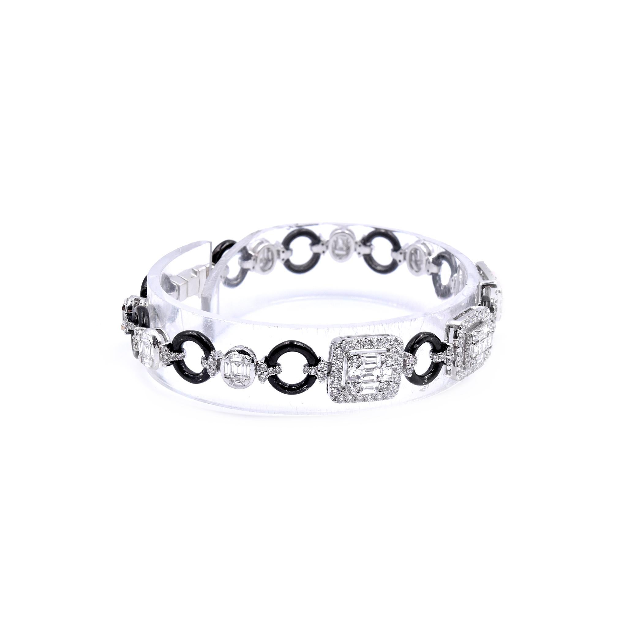 Material: 18K white gold
Diamonds: 162 round cut = 1.63cttw
Color: G
Clarity: VS1
Diamonds: 45 baguette cut = 1.57cttw
Color: G
Clarity: VS
Dimensions: bracelet will fit up to a 7-inch wrist
Weight: 14.82 grams
