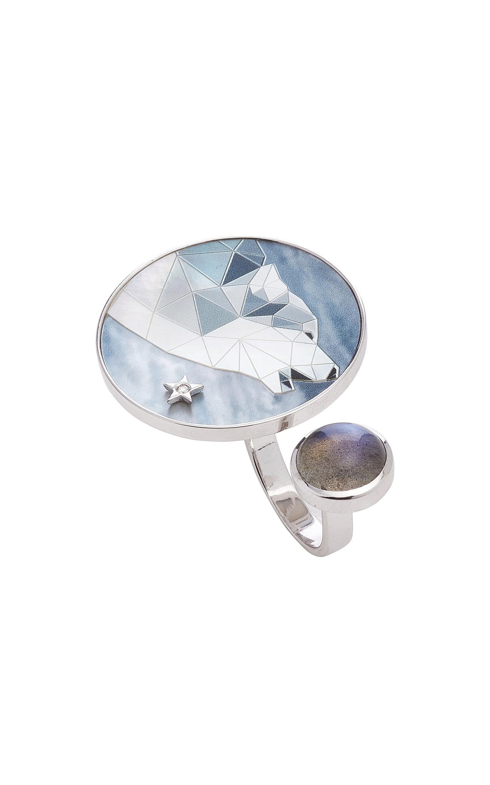 Art Wild Collection - Wolf at the moon - Ring between fingers. 
18K white gold (8 g) - Engraved and hand painted wolf on mother of pearl expresses a movement through the action of howling at the moon.
Wolf is a very special animal, it represents