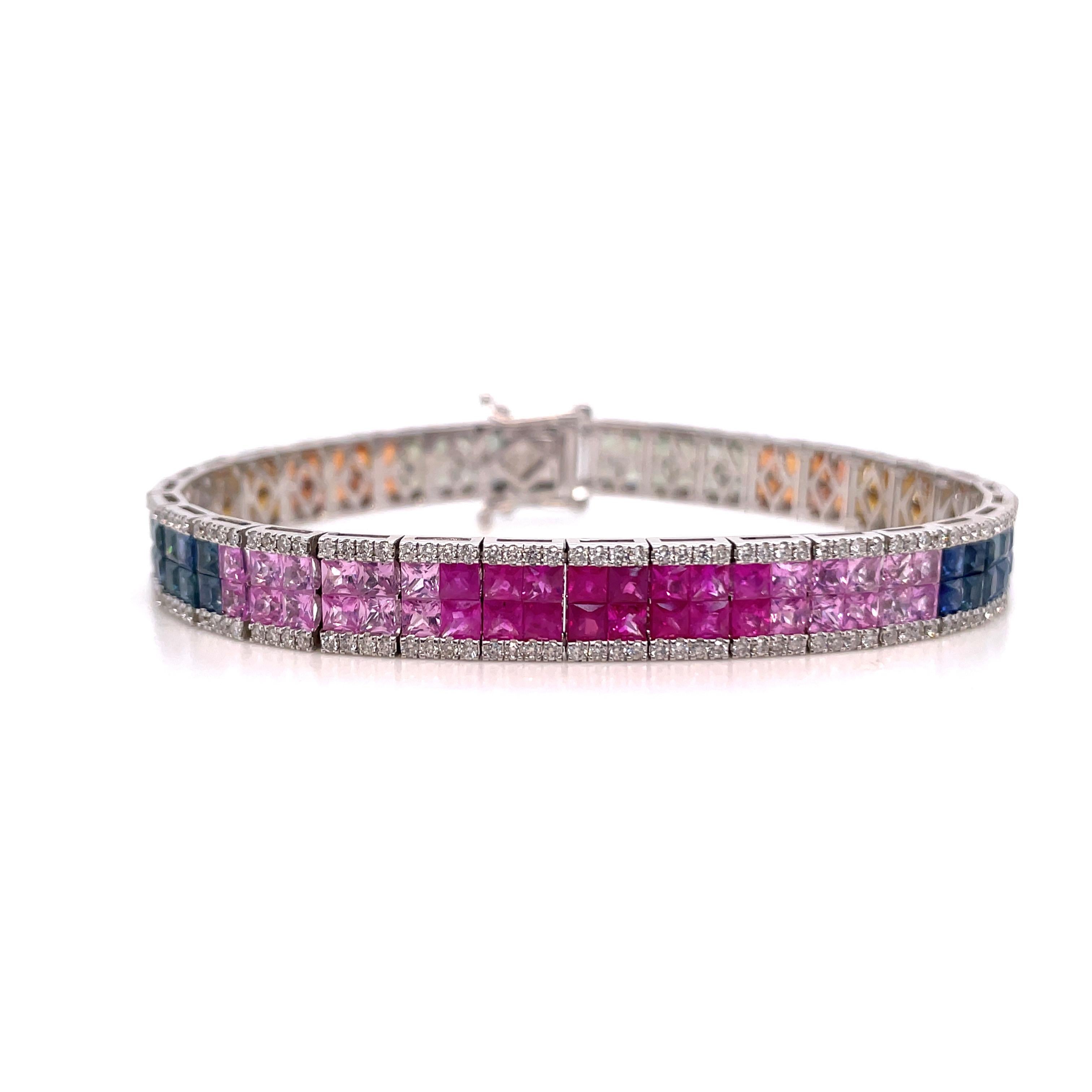 18 Karat White Gold bracelet featuring an Ombree rainbow design of Orange, Yellow, Blue, Pink & Green Princess Cut Sapphires weighing 16.50 carats with 272 round brilliants weighing 1.66 carats. 