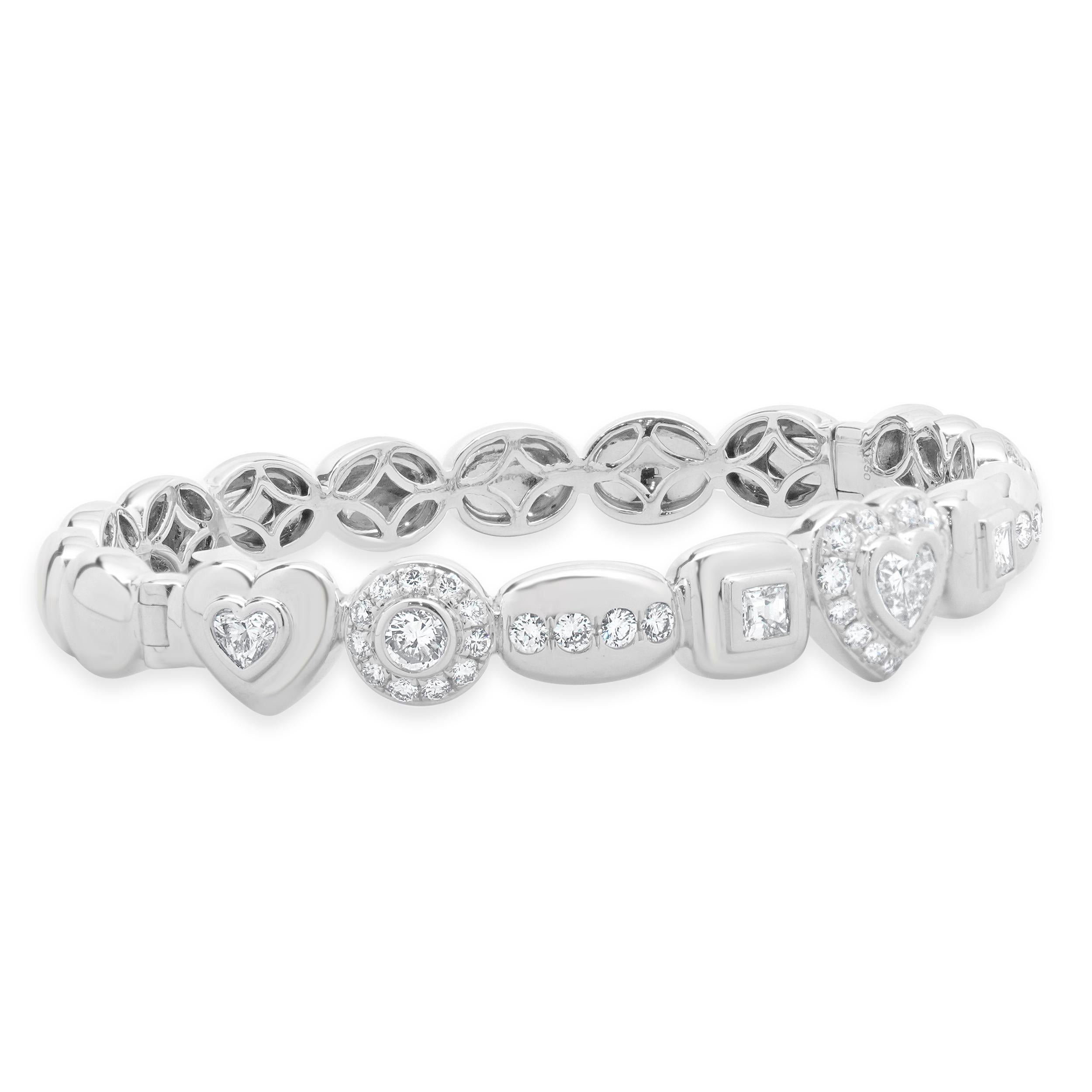 Designer: custom
Material: 18K white gold
Diamond: 46 round brilliant cut = 1.55cttw
Color: H
Clarity: VS2
Diamond: 5 fancy cut = 1.35cttw
Color: H
Clarity: VS2-SI1
Dimensions: bracelet will fit up to a 7-inch wrist
Weight: 25.39 grams