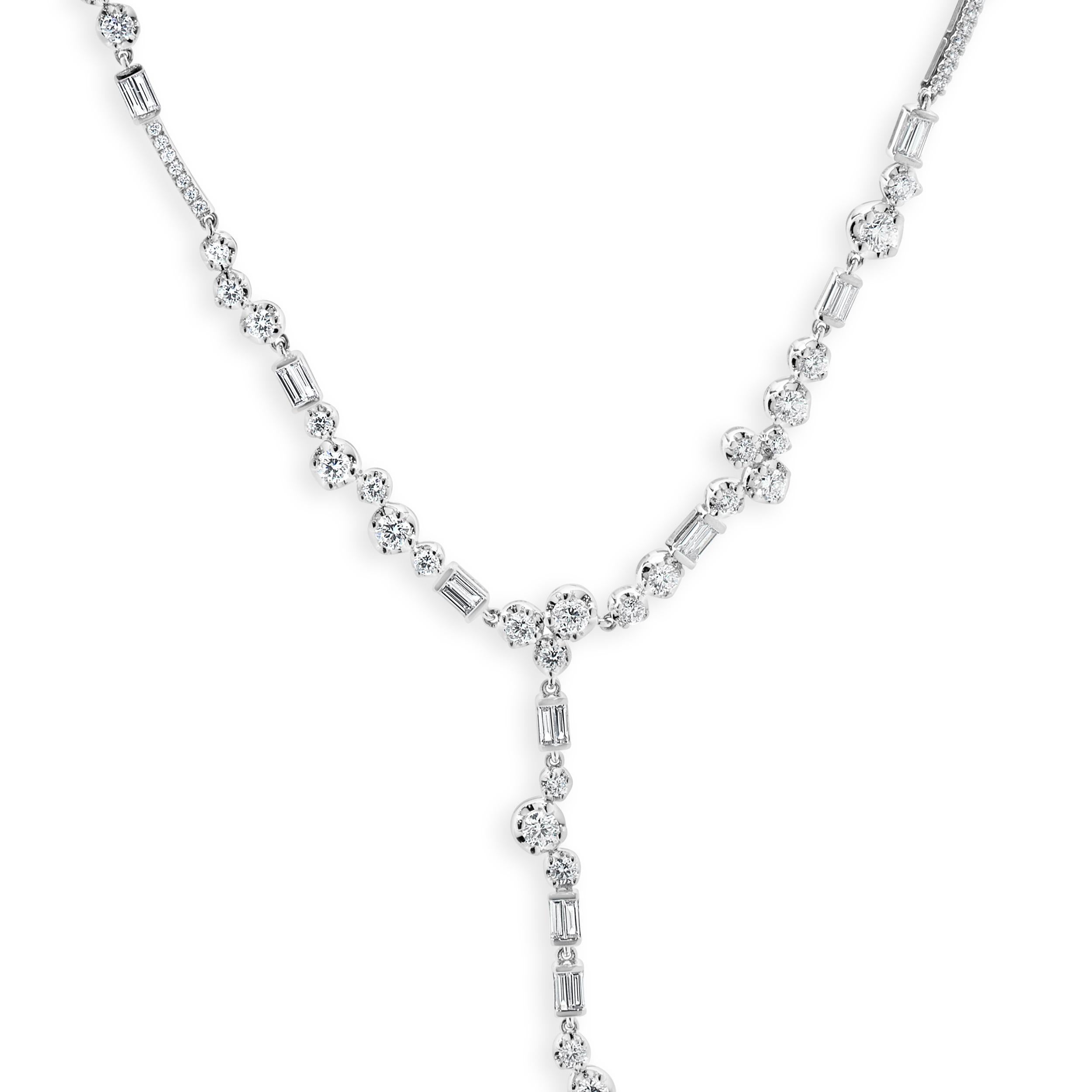 Designer: custom
Material: 18K white gold
Diamonds: 94 round brilliant cut = 2.34cttw
Color: G
Clarity: VS1-2
Diamonds: 20 baguette cut = 0.48cttw
Color: G
Clarity: VS1-2
Dimensions: necklace measures 18-inches in length 
Weight: 18.92 grams
