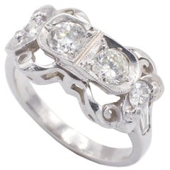 Antique 18 Karat White Gold Natural Diamond Baguette 
Round Stone Ring