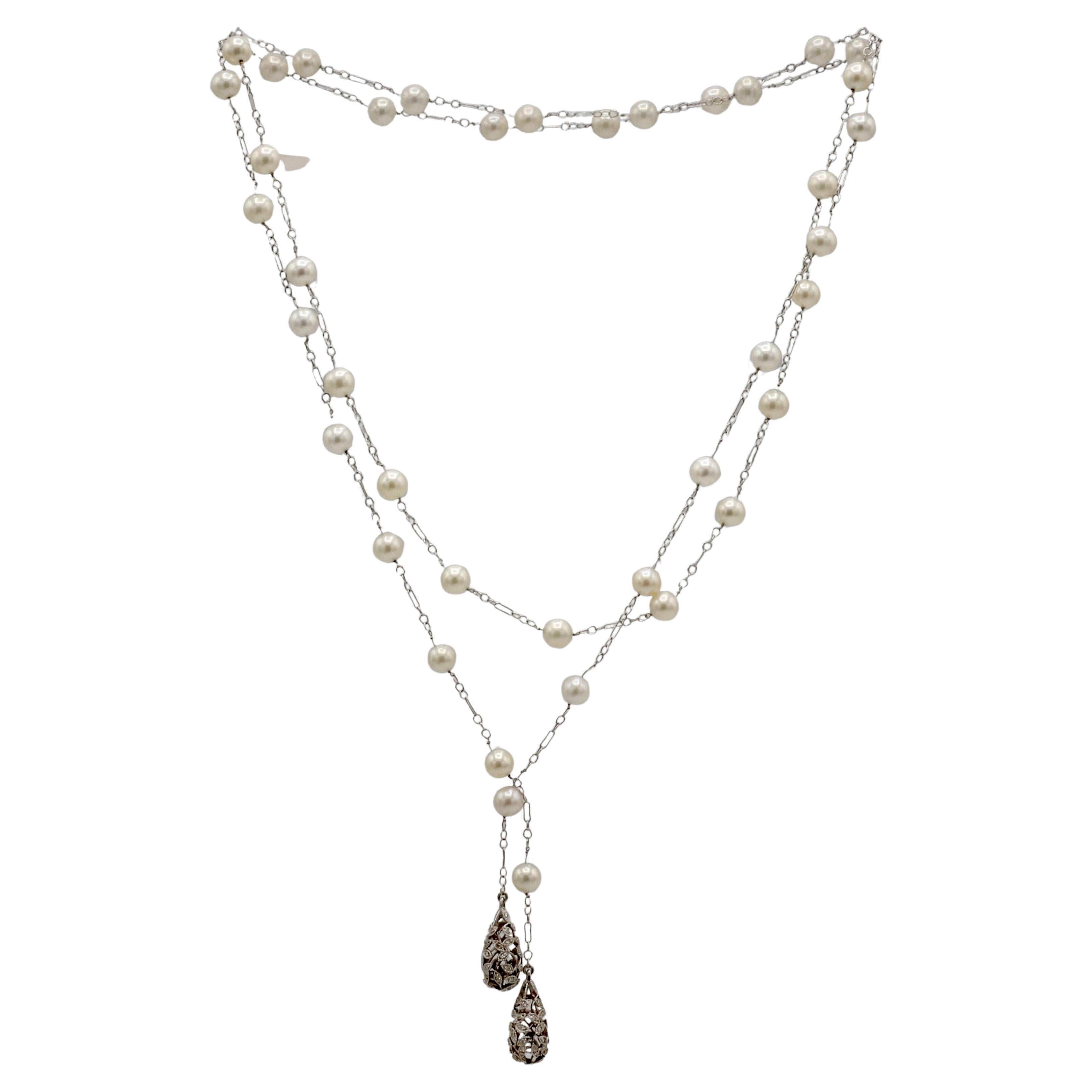 18 Karat White Gold Natural Diamond & Pearl Lariat Drop Necklace 45 Inches
Metal: 18k white gold
Weight: 25.73 grams
Pearls: 7mm white cultured pearls with creamy luster
Diamonds: Approx. .80 CTW round natural diamonds G-H SI
Length: 45 inches
SDD