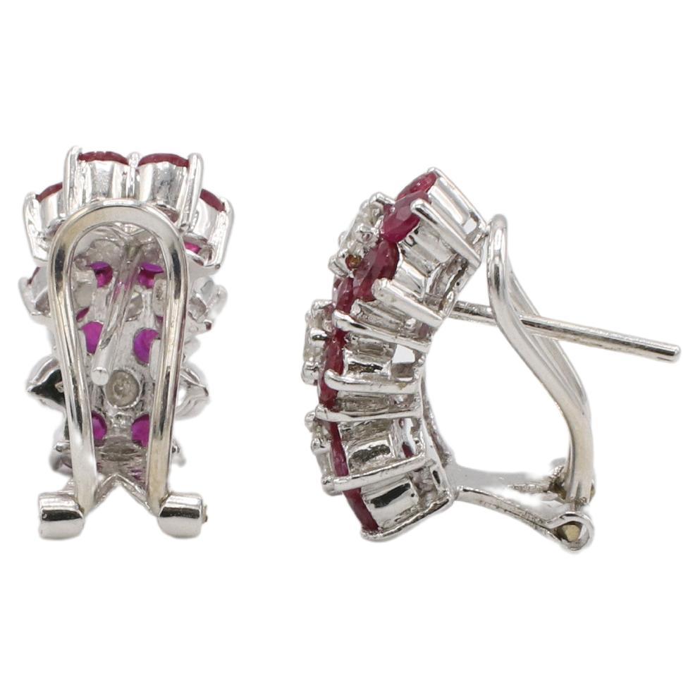 18 Karat White Gold Natural Diamond & Ruby Flower Earrings 
Metal: 18k white gold
Weight: 6.82 grams
Diamonds: Approx. 0.36 CTW round natural G-H SI diamonds
Dimensions: 9.5 x 15.5mm
Backs: Lever backs with posts 