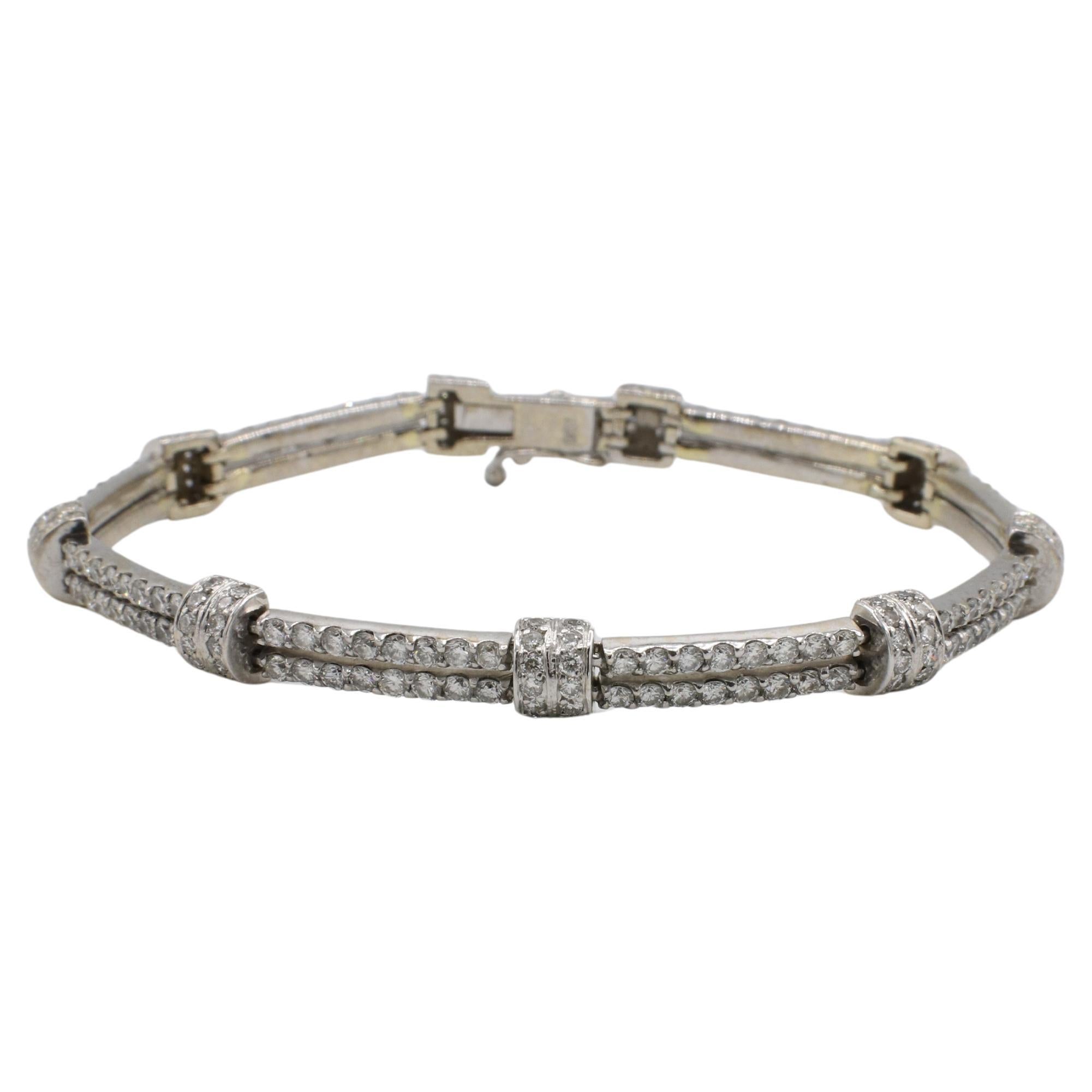18 Karat White Gold Natural Diamond Two-Row Tennis Line Bracelet 
Metal: 18k white gold
Weight: 14 grams
Diamonds: Approx. 5.00 CTW G-H VS-SI round natural diamonds
Length: 6.5 inches (clasped)
Width: 4.5mm
RDDD F35000977