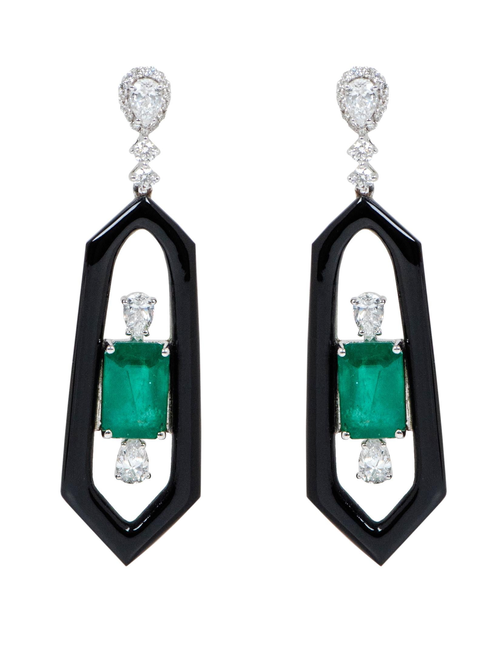 18 Karat White Gold Natural Emerald, Diamond, and Black Onyx Dangle Earrings

This impeccable contemporary dark green emerald and diamond earring pair is exceptional. The emerald cut emerald in the center is exemplified with a solitaire pear-shaped