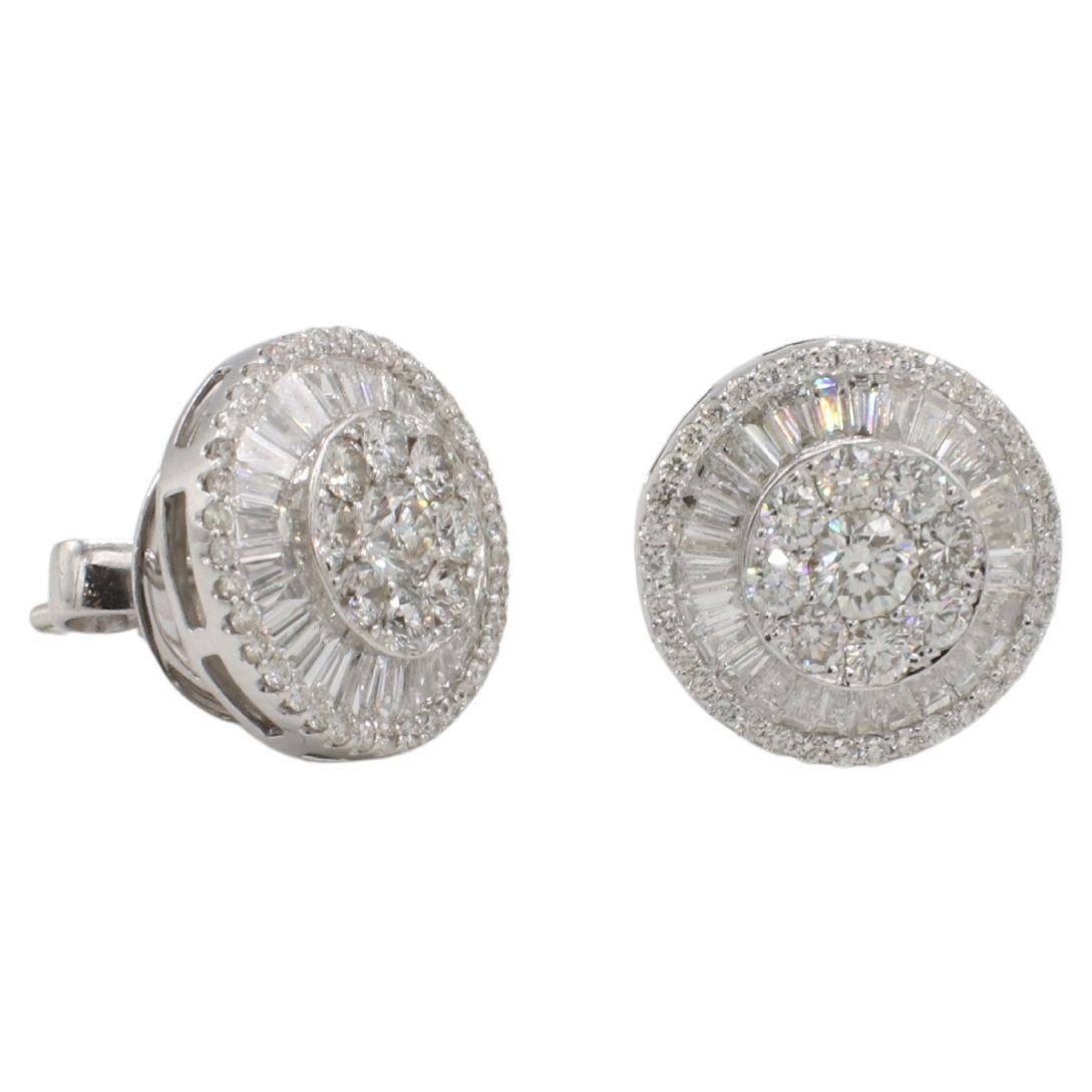18 Karat White Gold Natural Round & Baguette Halo Cluster Stud Earrings 
Metal: 18k white gold
Weight: 8.29 grams
Diamonds: Approx. 3.00 CTW G-H VS-SI Round & baguette natural diamonds
Diameter: 14.5mm
Backs: Friction backs (posts)
ONT F35001354
