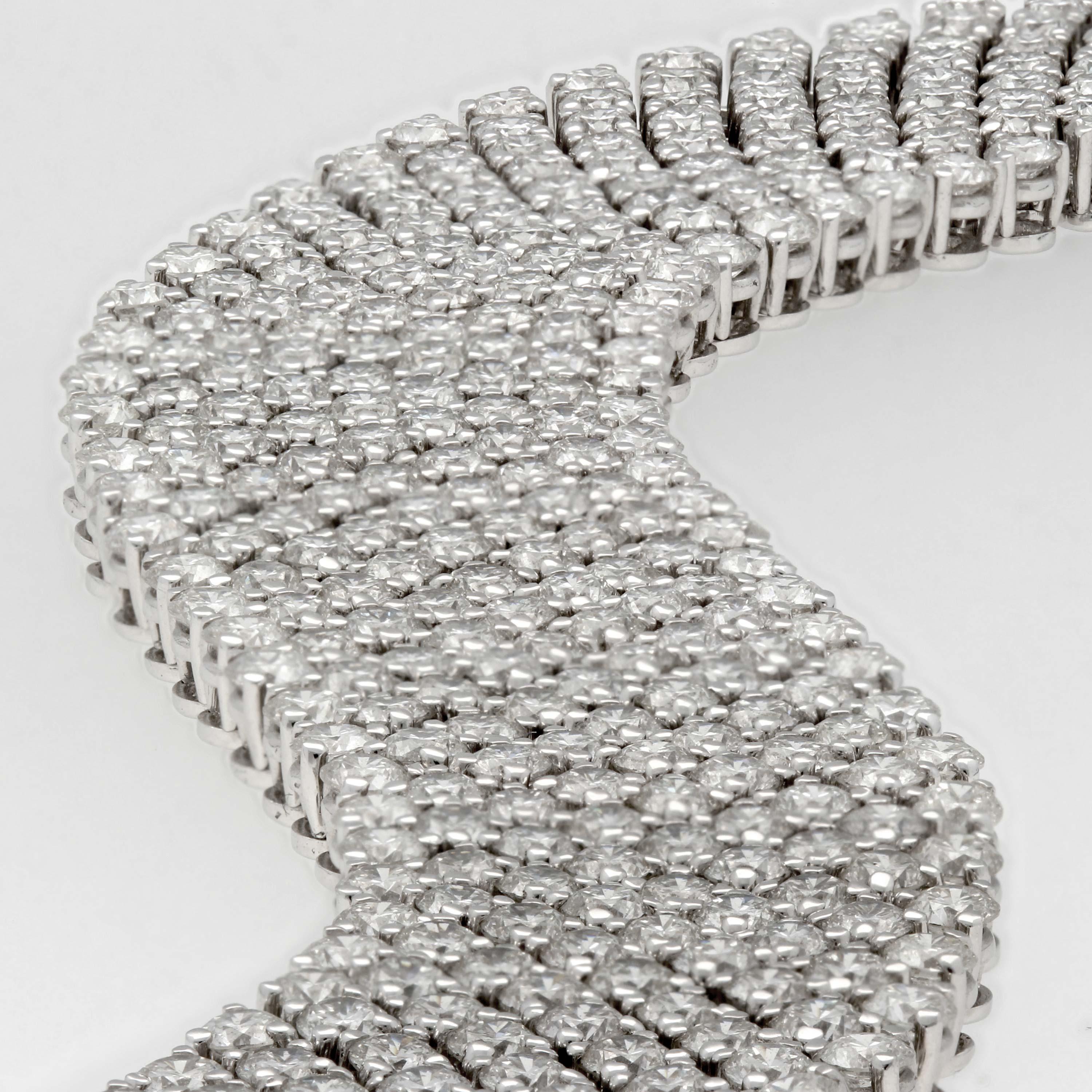 Round Cut 18 Karat White Gold Nine Row Flexible Diamond Bracelet, 32.10 Total Carats For Sale