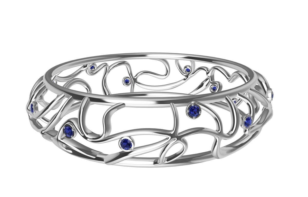 18 Karat White Gold Sapphires Oceans Bangle,  1.68 ct. wt. AGTA  14 sapphires.  More blue all year long! My favorite place on earth. The ocean. Now with sparkling sapphires. As unpredictable as the ocean. Different every time with its currents,