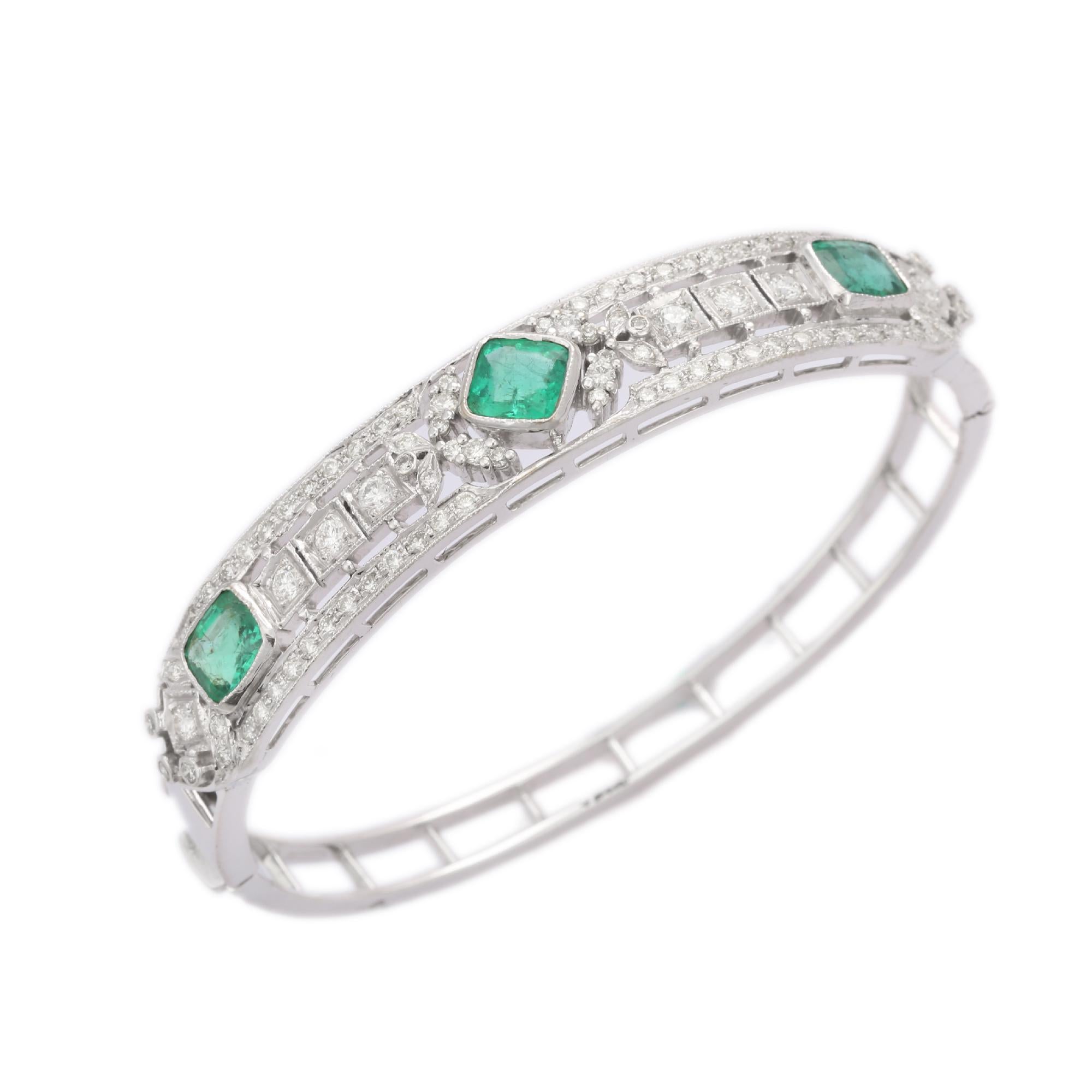 This Emerald Diamond Clamper Bracelet in 18K gold showcases 3 endlessly sparkling natural emeralds, weighing 3.33 carat and  diamonds weighing 1.43 carat. It measures 65 mm in length and 53 mm in width.
Emerald enhances the intellectual capacity of