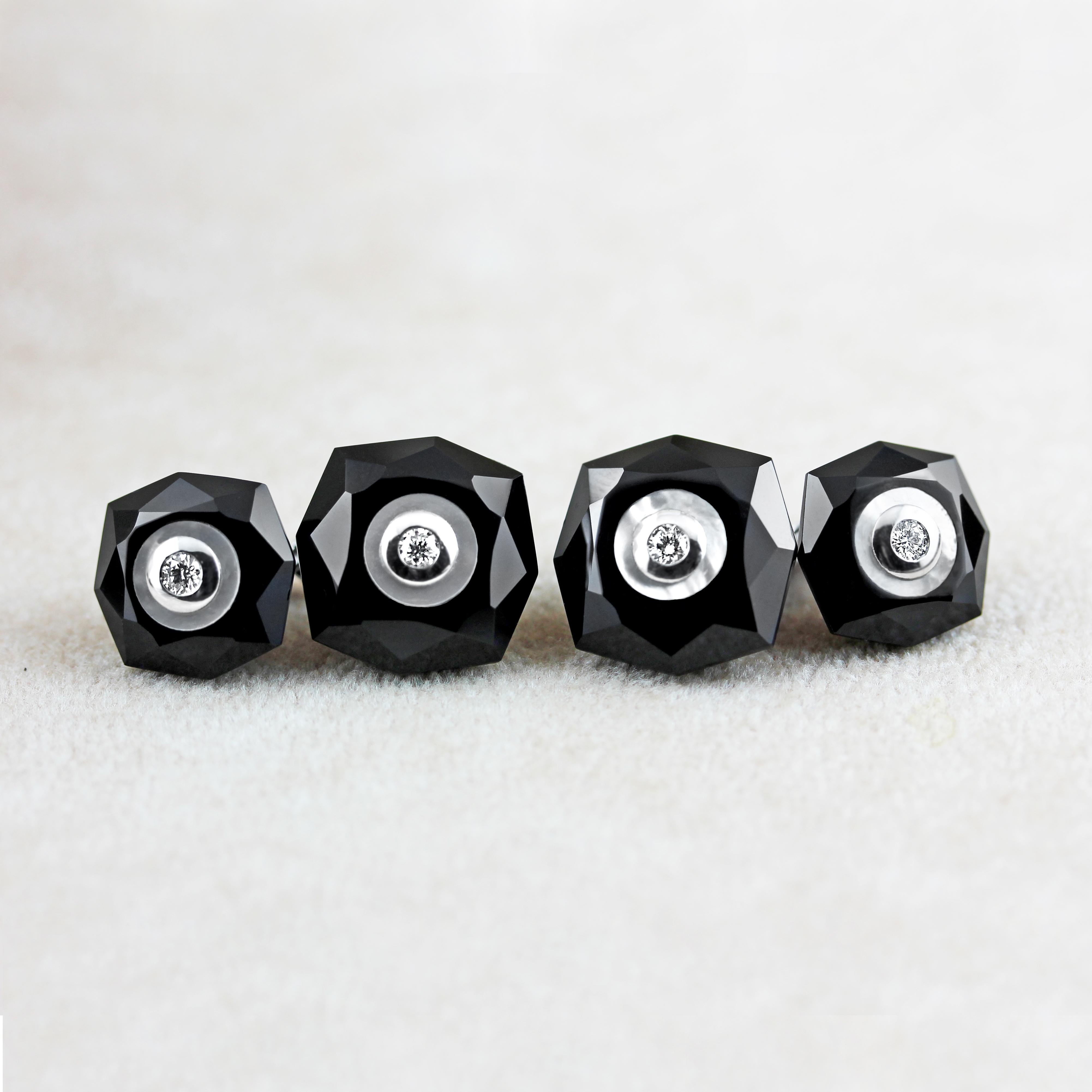 The striking contrasting color combination of the black onyx with the delicate shimmer of the mother of pearl gives character to these exquisite cufflinks, in which both front face and toggle are shaped as a multifaceted octagon. 
The center of each