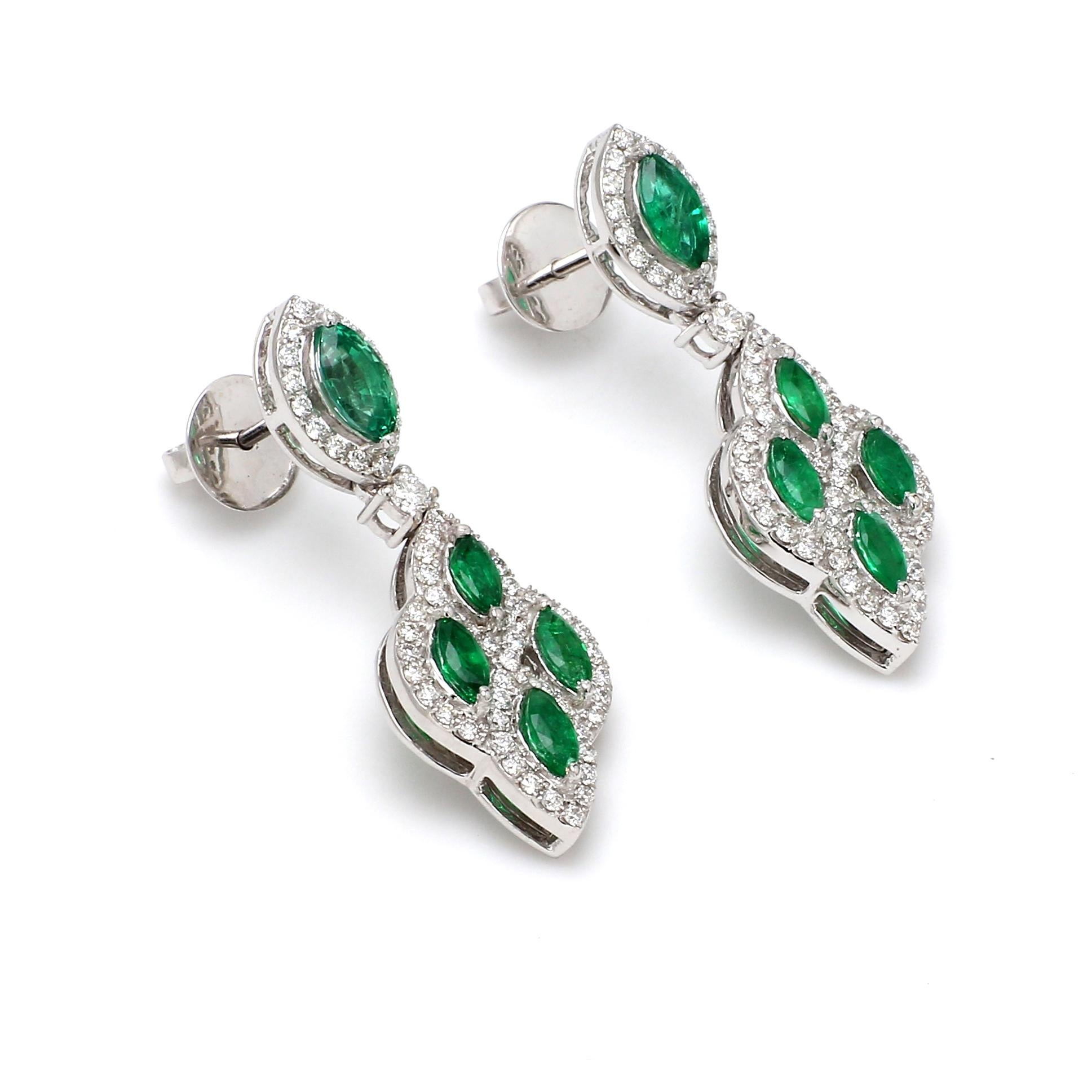 A Beautiful Handcrafted Emerald Earring in 18 karat White Gold with Old Mined Sandwana Emeralds and  Natural Brilliant Cut Colorless Diamonds. A Statement piece for Evening Wear

Emerald Details
Pieces : 10 Pieces Marquise Shape
Weight : 1.86 Carat