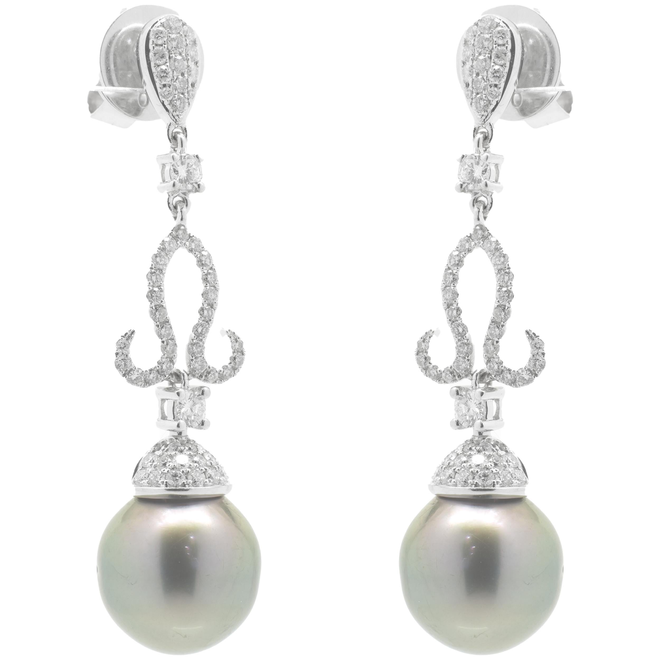 Designer: custom designed
Material: 18K white gold
Pearls: 2  semi round Tahitian pearls
Diamonds: round brilliant cut = 1.00cttw
Color: G
Clarity: VS1-2
Fastenings: posts with friction backs
Dimensions: earrings measure 43mm in length 
Weight: 9.73