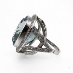 18 Karat White Gold Oval Aquamarine 19.33ct and Diamond Cluster Ring