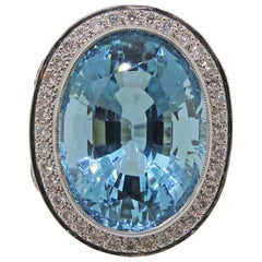 18 Karat White Gold Oval Aquamarine 19.33ct and Diamond Cluster Ring