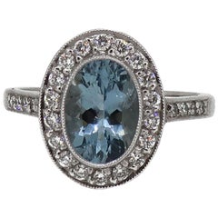 18 Karat White Gold Oval Aquamarine and Diamond Art Deco Style Cluster Ring