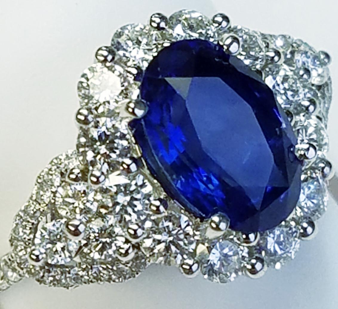 Contemporary 18 Karat White Gold Oval Cut Blue Sapphire and Diamond Ring
