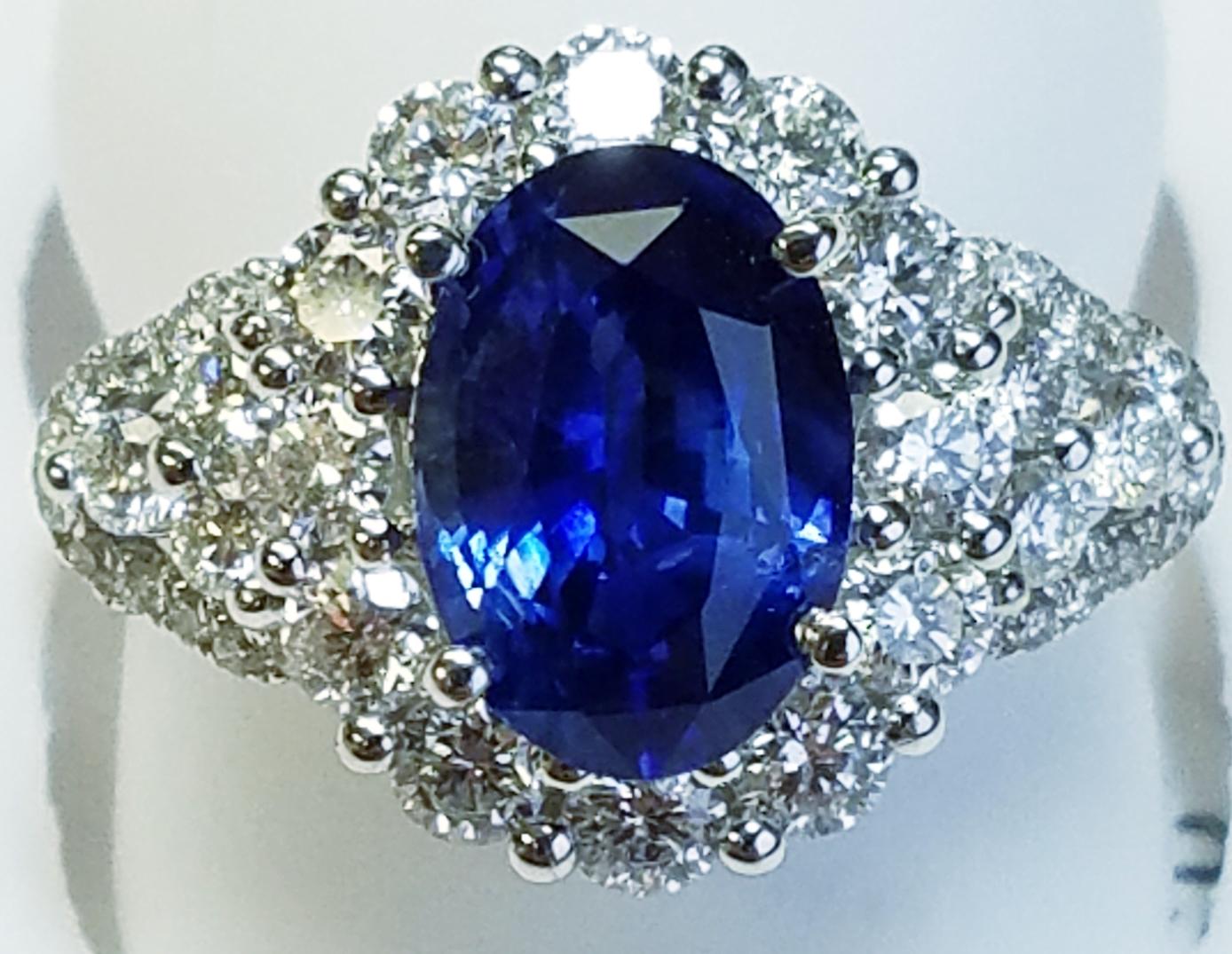 Women's or Men's 18 Karat White Gold Oval Cut Blue Sapphire and Diamond Ring