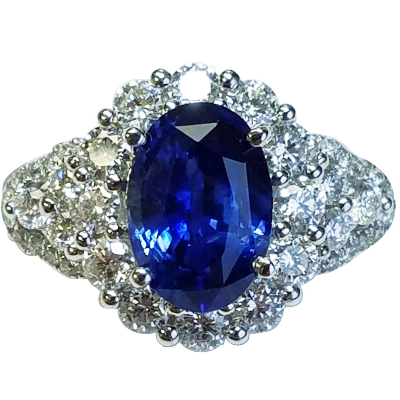 18 Karat White Gold Oval Cut Blue Sapphire and Diamond Ring
