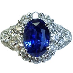 18 Karat White Gold Oval Cut Blue Sapphire and Diamond Ring
