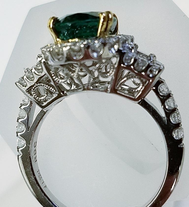 Contemporary 18 Karat White Gold Oval Cut Emerald and Diamond Ring