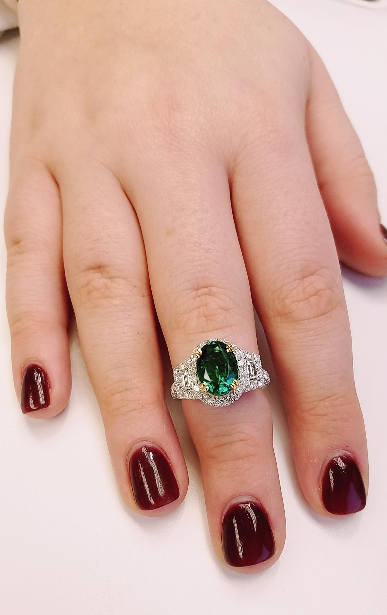 18 Karat White Gold Oval Cut Emerald and Diamond Ring In New Condition In Great Neck, NY