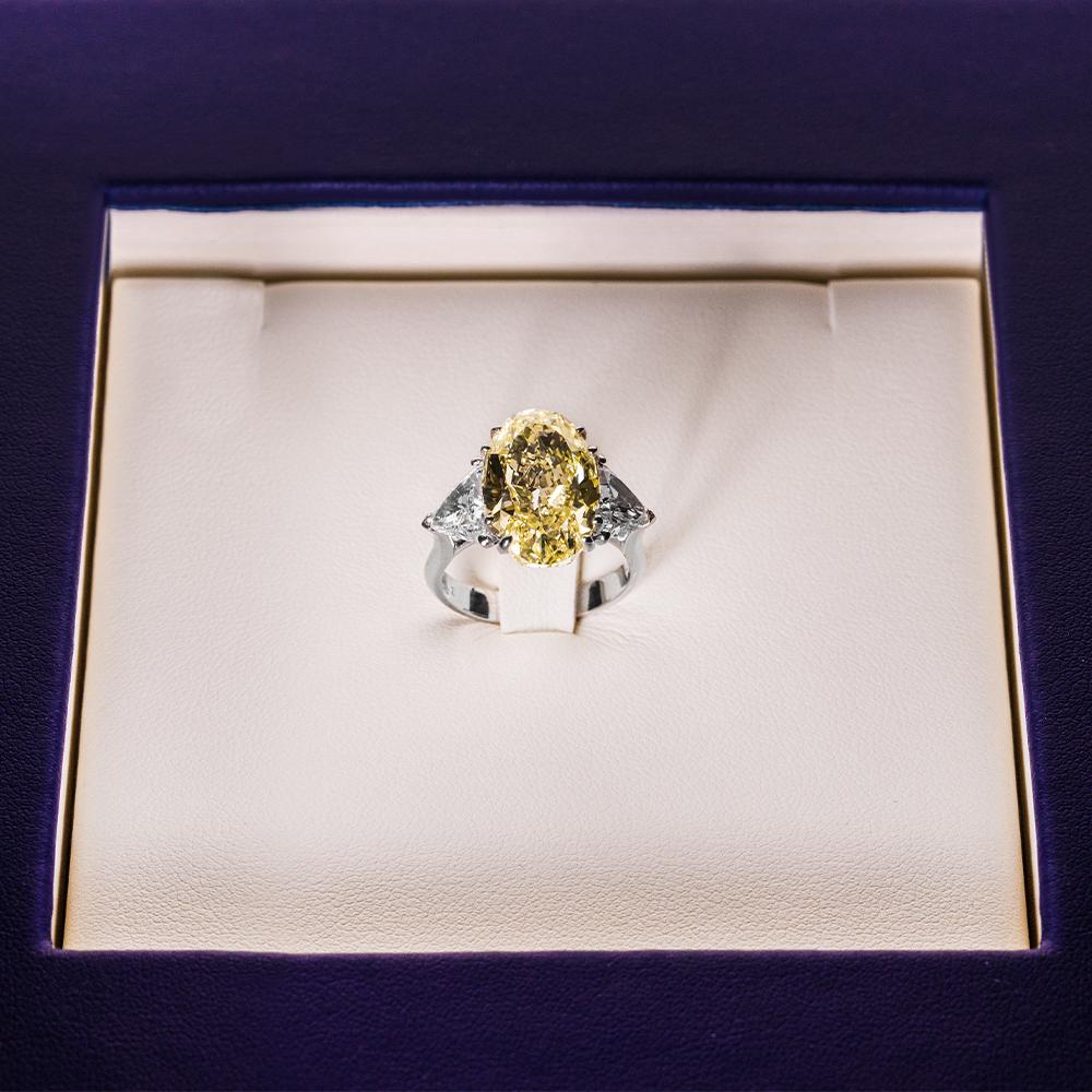 Women's 18 Karat White Gold Oval Cut Fancy Yellow Trillion Diamond Engagement Ring For Sale