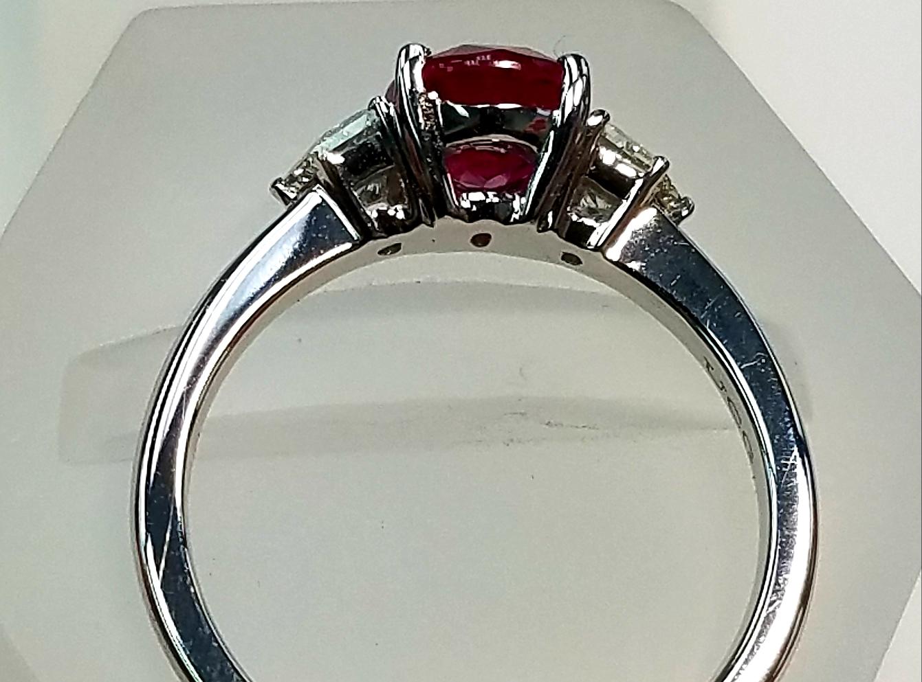 18 Karat White Gold Three Stone Oval Cut Ruby and Diamond Ring
1.80 Carats of Rubies
0.46 Carats of Half Moon Fancy Cut Genuine Diamonds
Oval Cut
18 Karat White Gold 