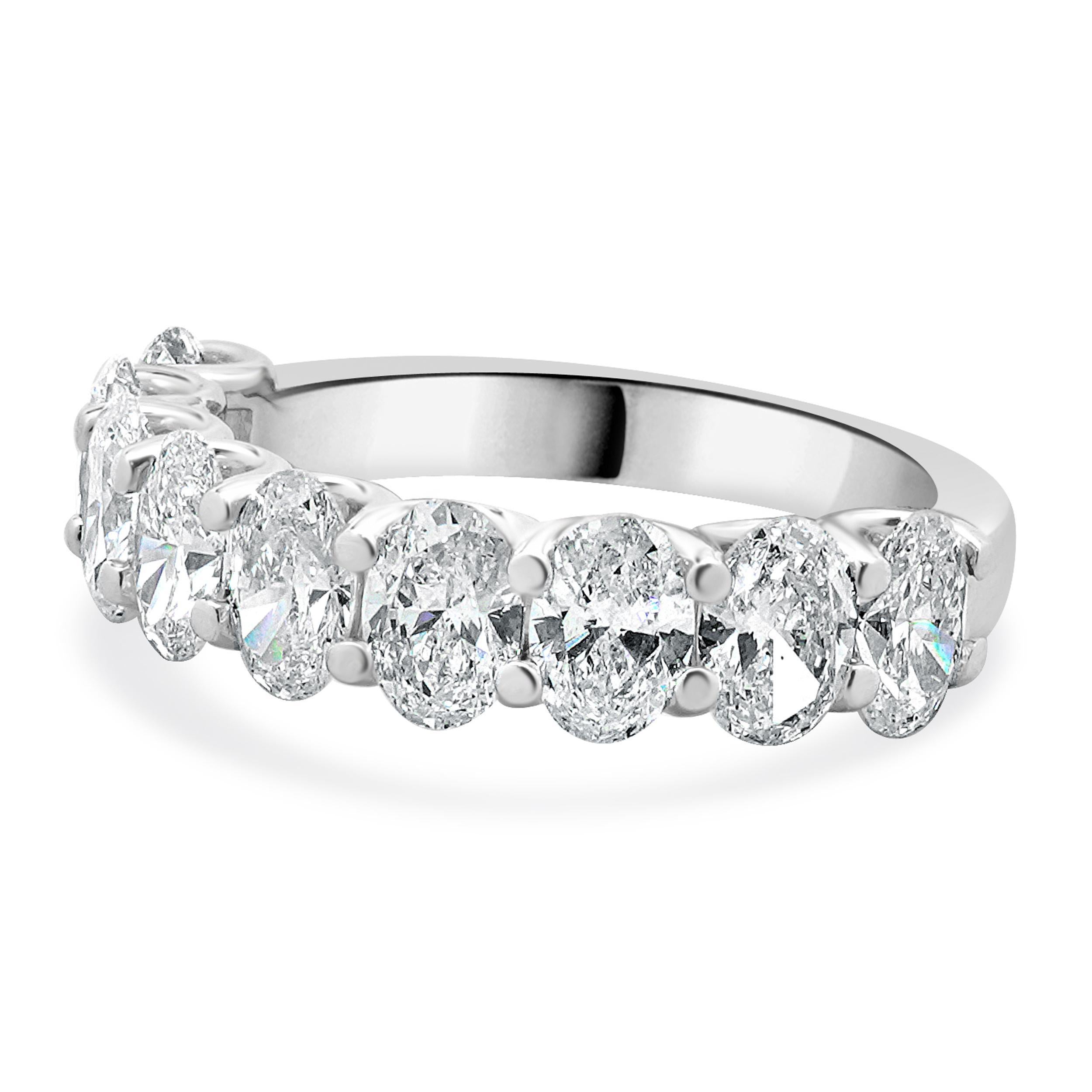 Designer: custom
Material: 18K white gold
Diamond: 9 oval cut = 3.01cttw
Color: G/H
Clarity: VS2-SI1
Ring size: 6.5 (please allow two additional shipping days for sizing requests)
Weight: 4.72 grams