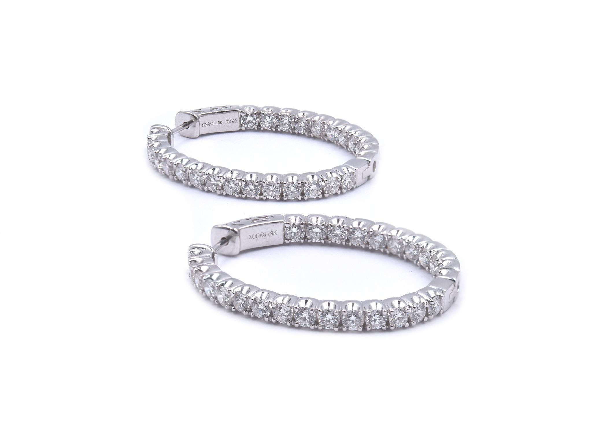 Designer: custom
Material: 18K white gold
Diamonds: 52 round brilliant cut = 5.50cttw
Color: G
Clarity: SI1
Dimensions: earrings measure 40mm long
Weight: 19.51 grams
