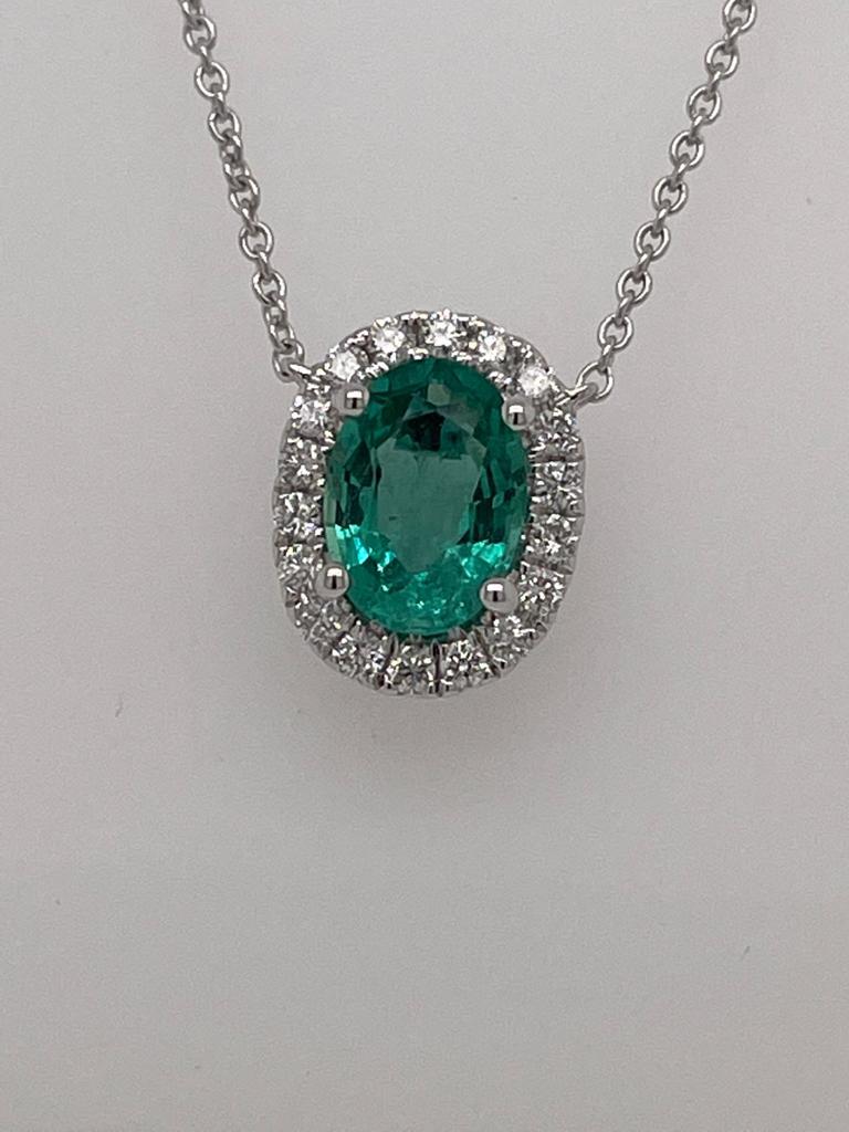 Oval Emerald weighing 0.78 cts.
Measuring (7.0x5.0) mm
Diamonds weighing .23 cts
Set in 18K white gold 
