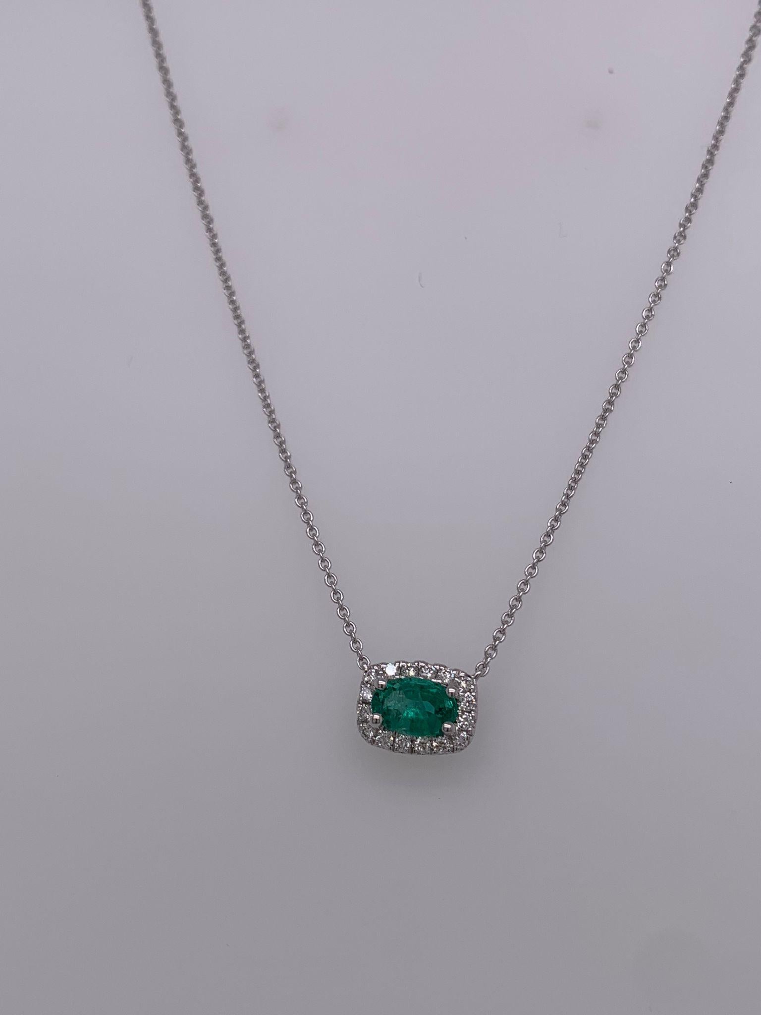 Oval Emerald weighing .44 cts
Measuring (5.5x3.5) mm
Diamonds weighing .10 cts
Set in 18K white gold 
