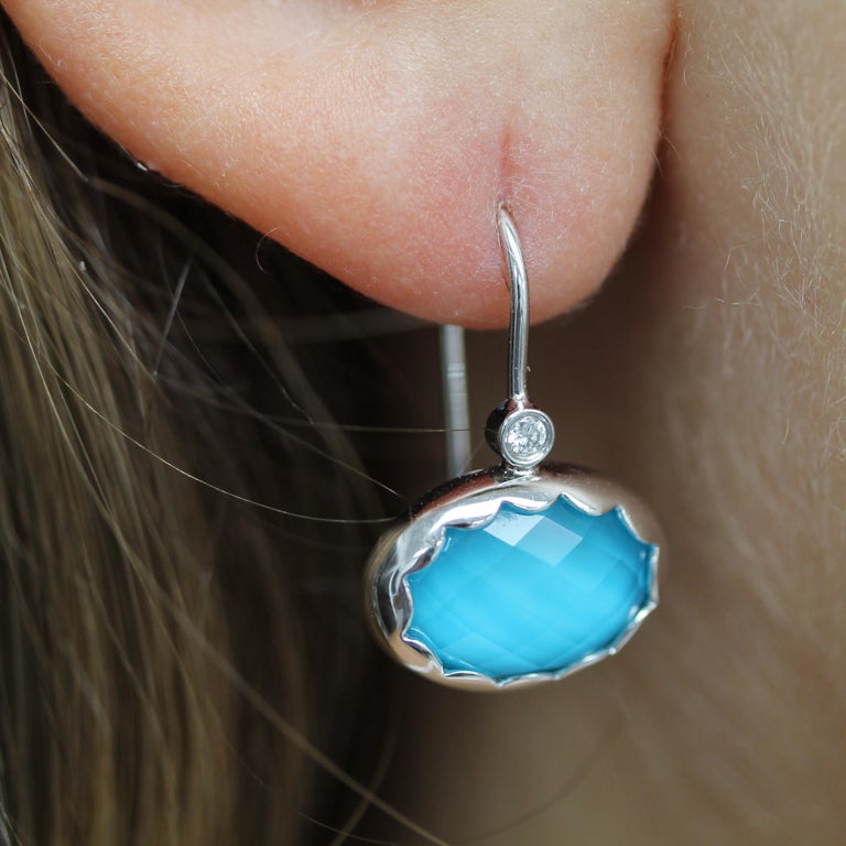 St. Barths Blue Dangle Earrings featuring checker-cut, Oval-shaped White Topaz layered with Natural Arizona Turquoise, Bezel-set Diamonds, set in 18K white gold. French Wire backs with snap enclosure. One-of-a-kind piece. The St. Barths Blue