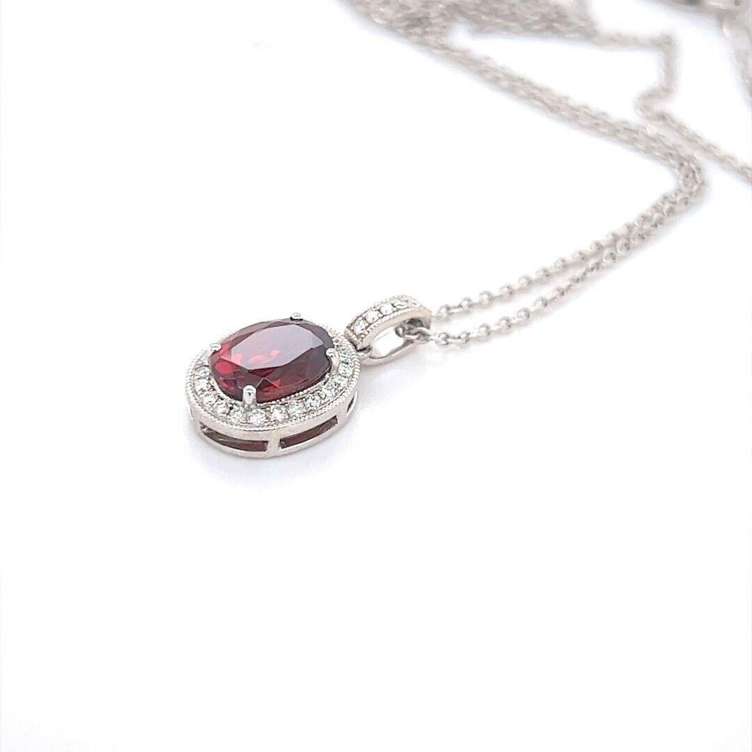18 Karat White Gold Oval Garnet and Diamond Halo Pendant Necklace In Good Condition In Guilford, CT