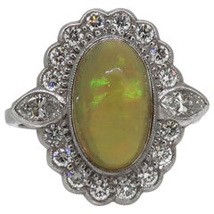 18 Karat White Gold Oval Opal and Diamond Art Deco Style Cluster Ring