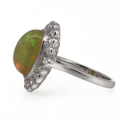 18 Karat White Gold Oval Opal and Diamond Art Deco Style Cluster Ring