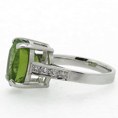 18 Karat White Gold Oval Peridot and Diamond Solitaire Ring