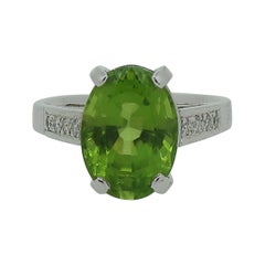 18 Karat White Gold Oval Peridot and Diamond Solitaire Ring