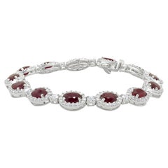 18 Karat White Gold Oval Ruby and Diamond Halo Inline Bracelet