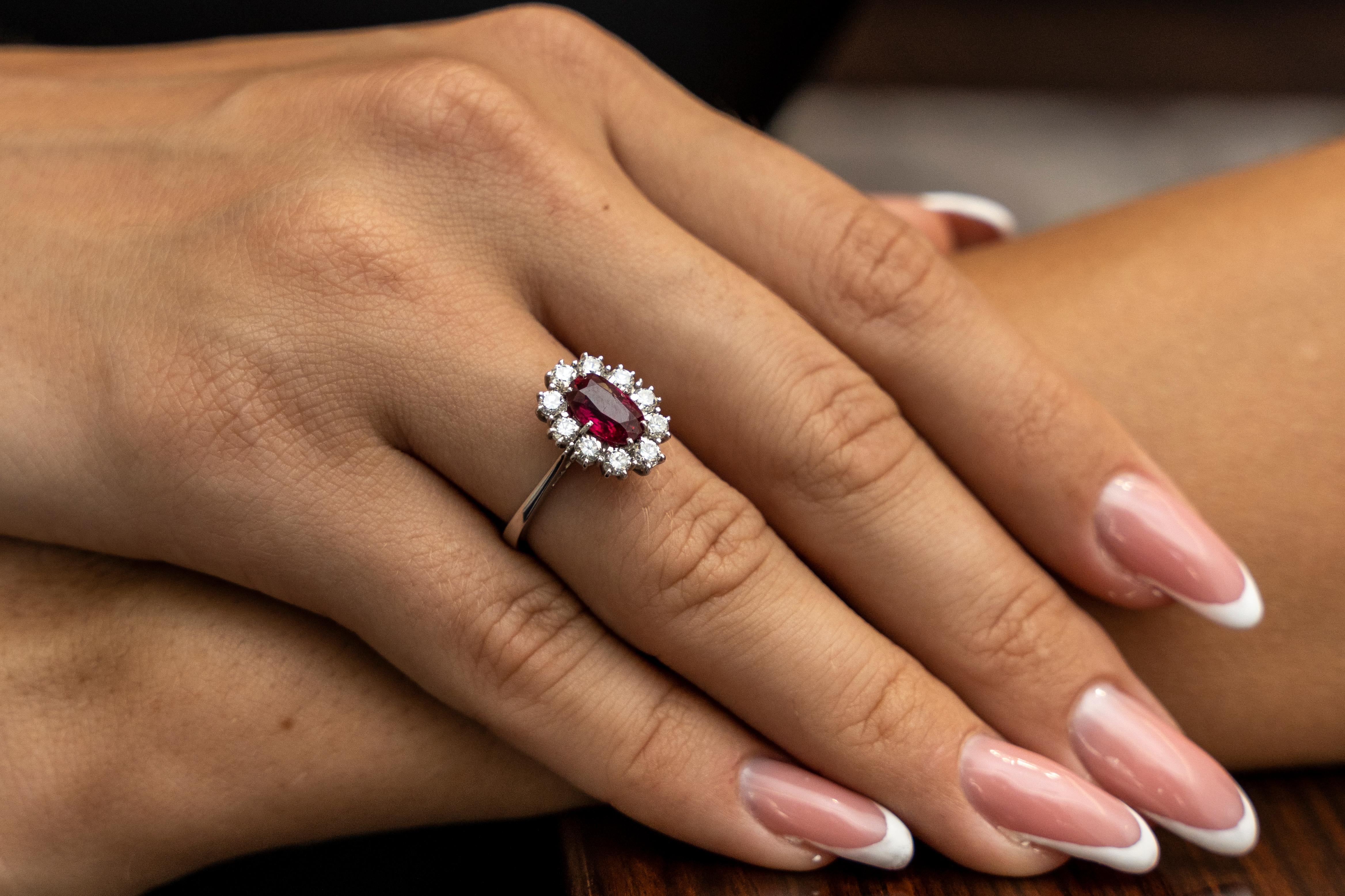 This 18K white gold stunning ring is from our Timeless Collection. It is made of a beautiful oval shape ruby in total of 1.52 Carat decorated by 10 natural colorless round shape diamonds in total of 0.68 Carat. Total metal weight is 4.70 gr. 