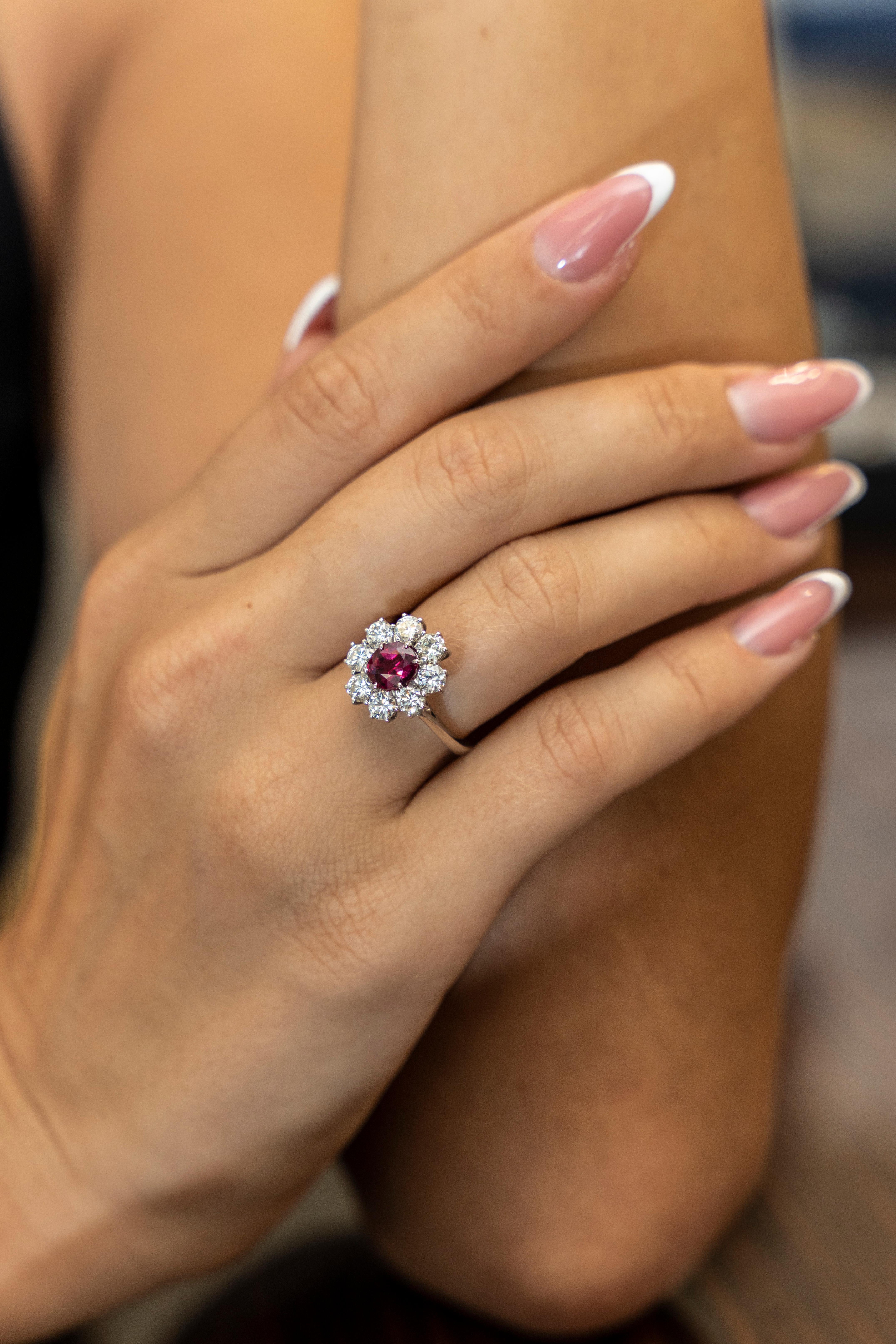 This 18K white gold stunning ring is from our Timeless Collection. It is made of a beautiful oval shape ruby in total of 1.27 Carat decorated by 8 colorless round shape diamonds in total of 1.40 Carat. Total metal weight is 4.37 gr.  Extraordinary