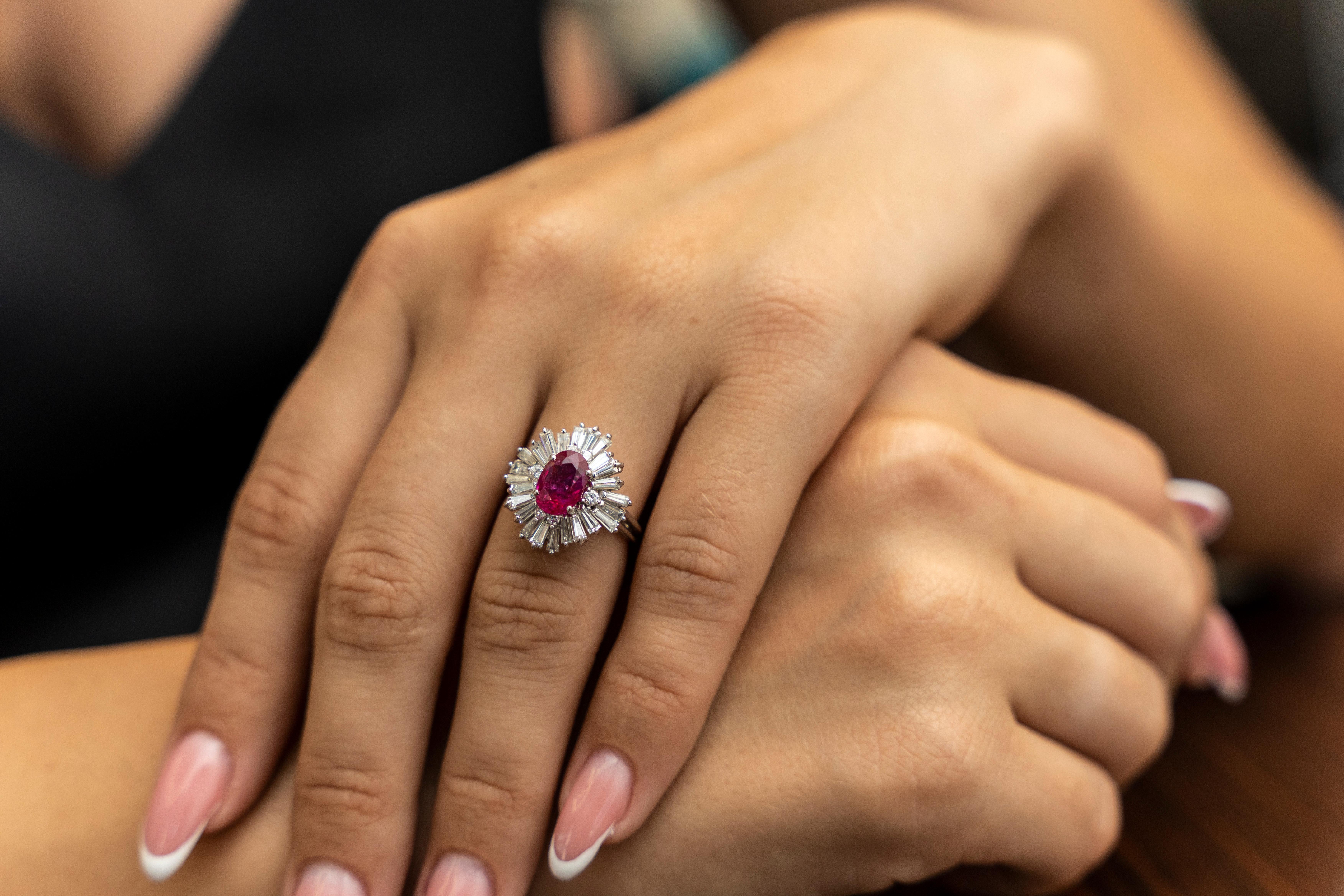 This 18K white gold elegant ring is from our Timeless Collection. It is made of a stunning oval shape ruby in total of 2.11 Carat decorated by tapered baguette shape colorless diamonds in total of 1.49 Carat. Total metal weight is 5.40 gr. 