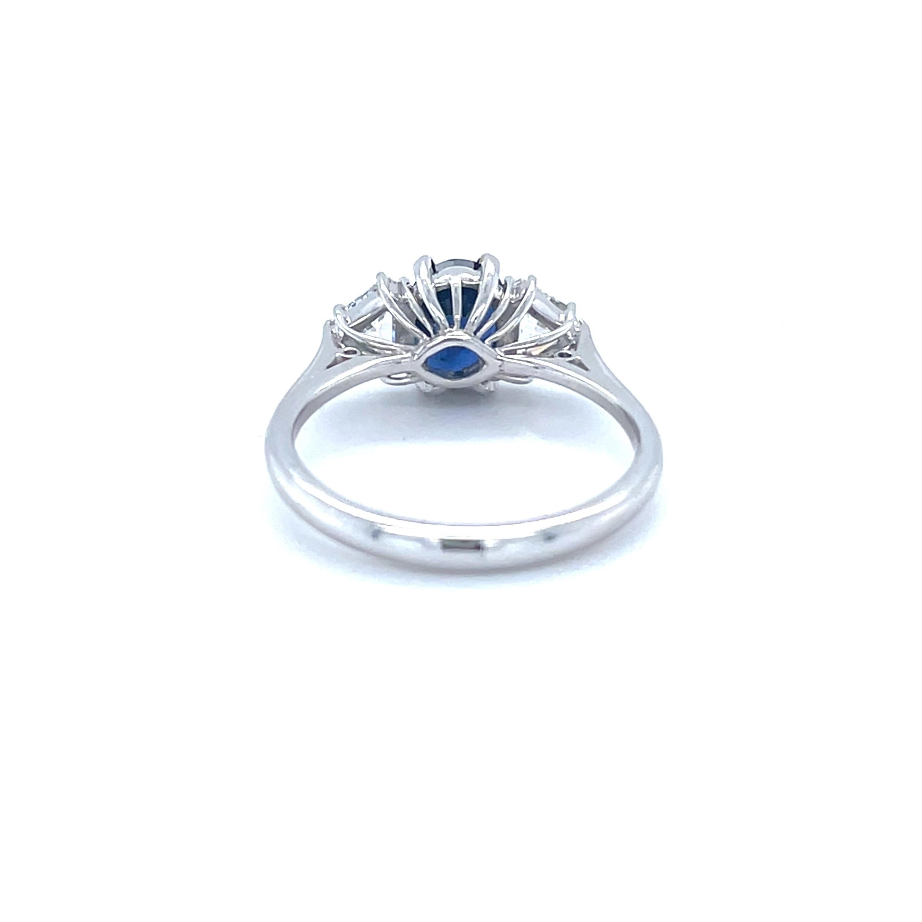Women's 18 Karat White Gold Oval Sapphire Trillion Diamond Cocktail Ring For Sale