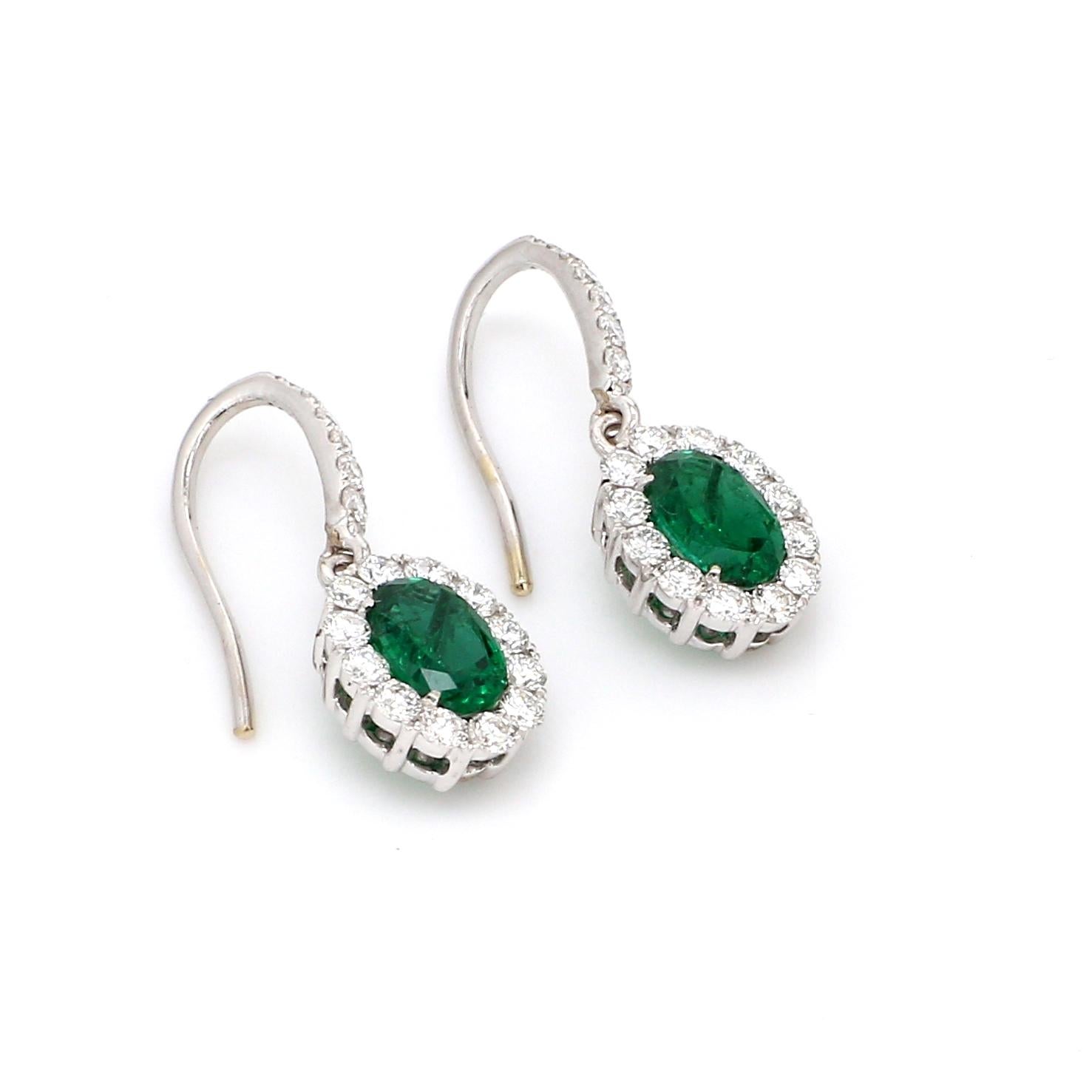 A Beautiful Handcrafted Emerald Earring in 18 karat White Gold with Natural No Treated Emeralds and  Natural Brilliant Cut Colorless Diamonds. A Statement piece for Evening Wear

Emerald Details
Pieces : 2 Pieces Oval Shape
Weight : 1.54 Carat