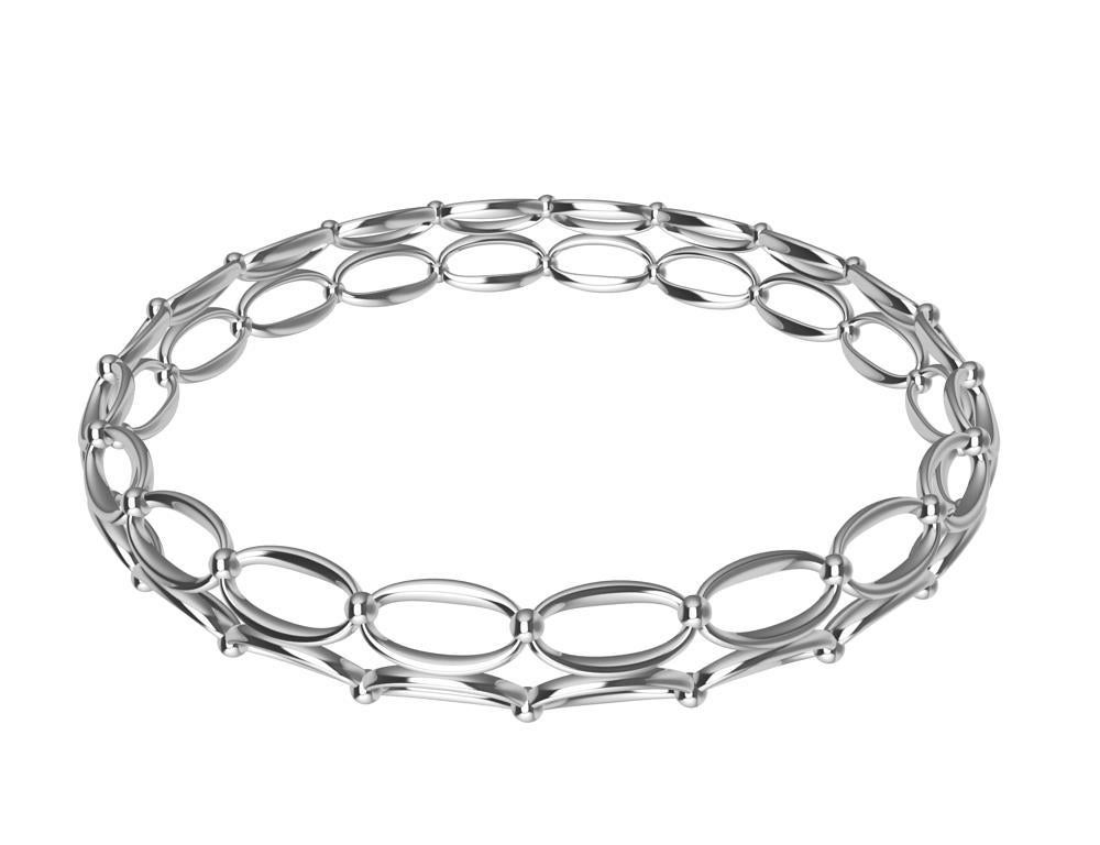 18 Karat White Gold Domed Ovals and Rhombus Bangle Bracelet, Tiffany designer ,Thomas Kurilla  This creation comes form my love of the decorative ironwork of Europe. The gates ,window guards, fences that were created as utilitarian purposes.  But