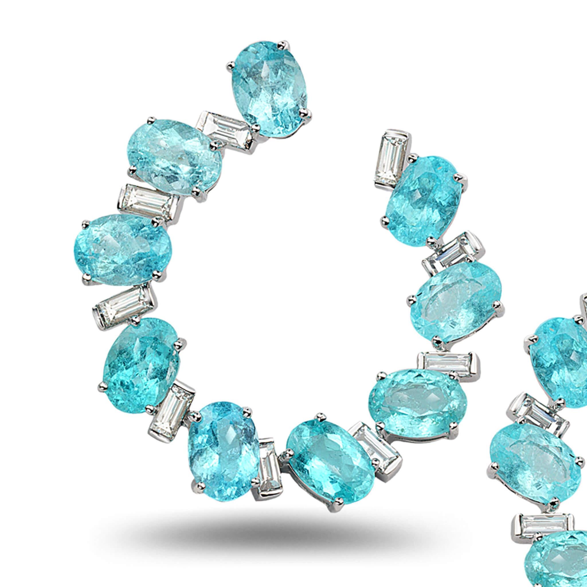 Trinity front hoop earrings set in 18K white gold with 14.46cts paraiba tourmaline and 1.49cts diamond.
