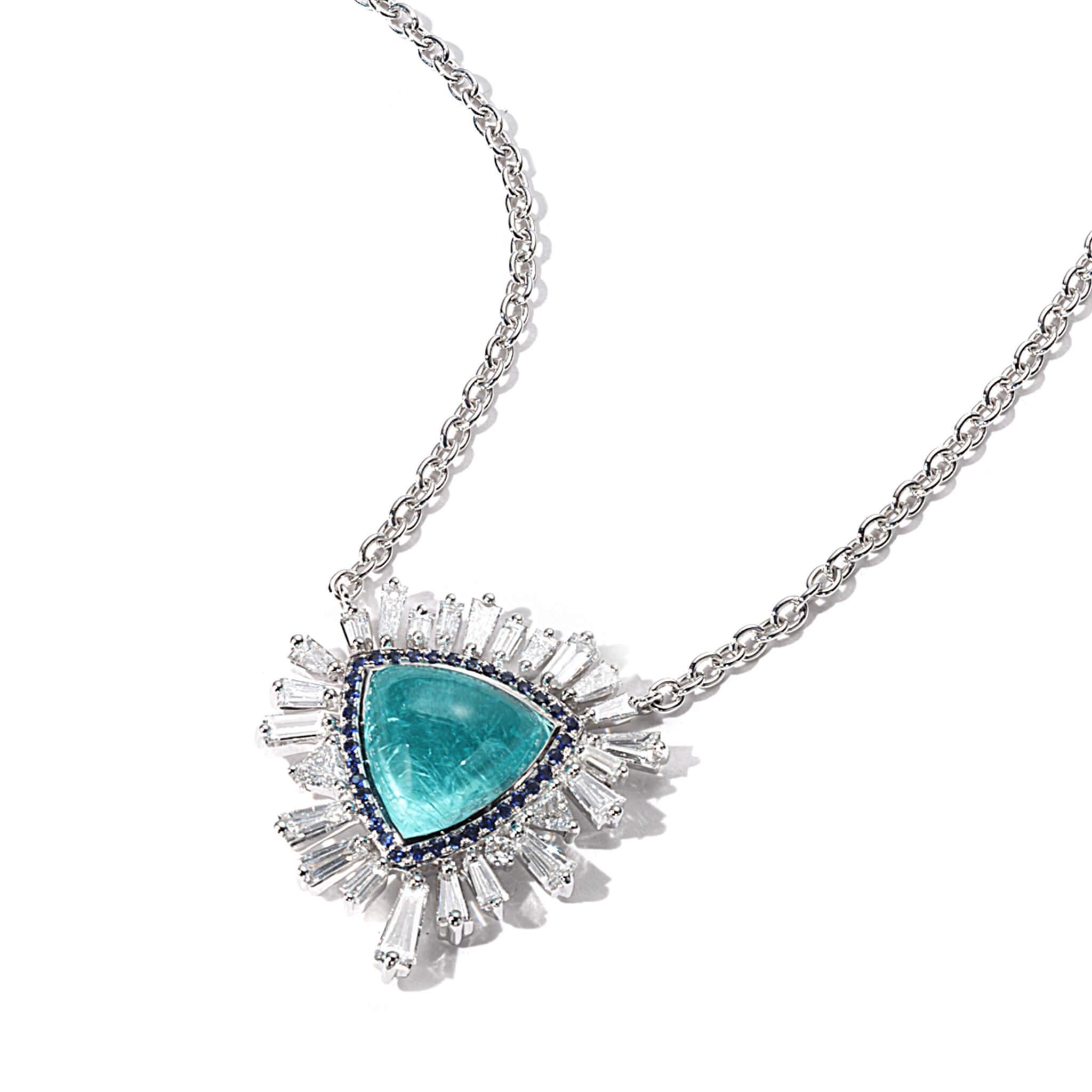 Trinity necklace set in 18K white gold with 5.45cts paraiba tourmaline, 1.73cts diamond, and 0.17cts sapphire.
