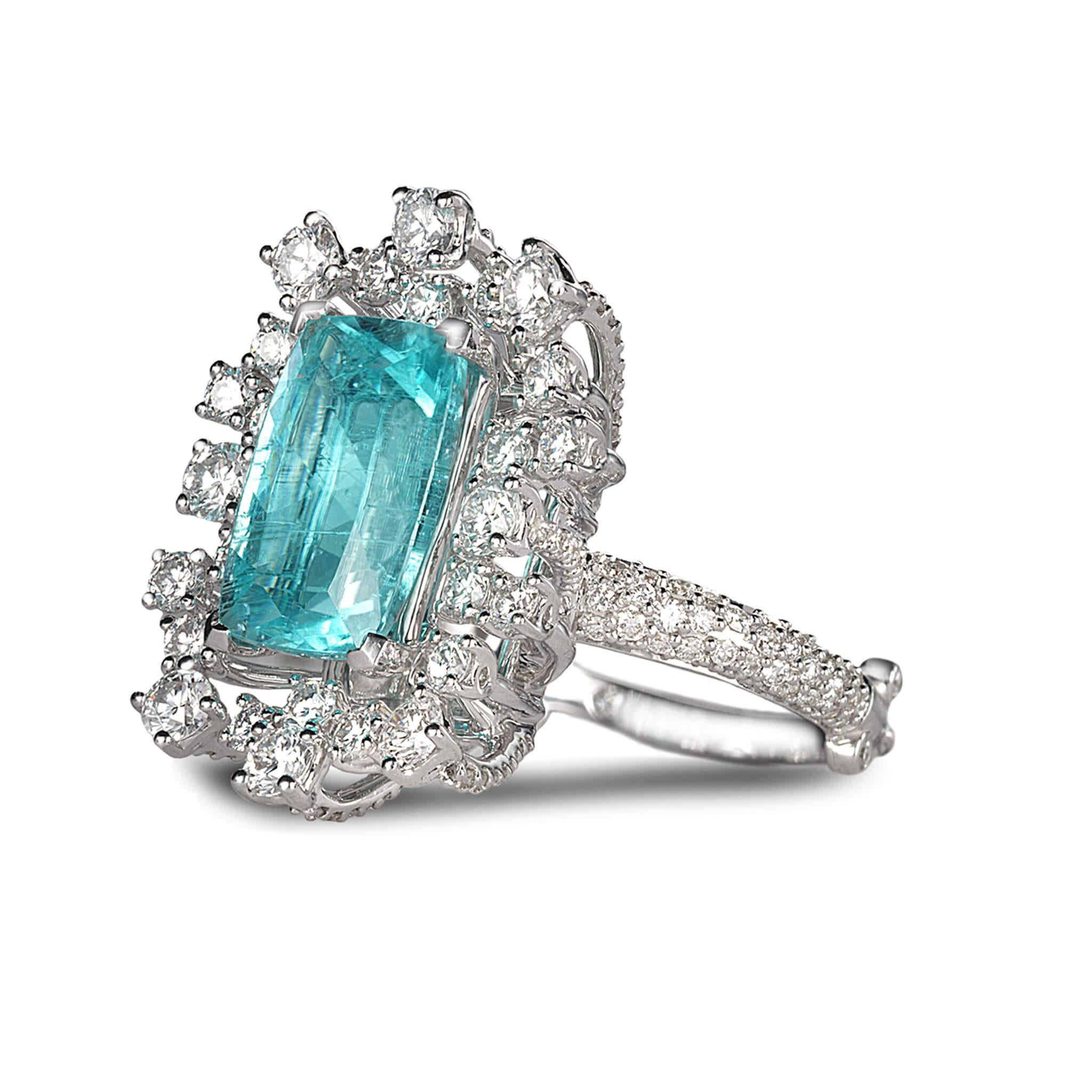 Trinity star burst ring set in 18K white gold with 4.68cts paraiba tourmaline and 2.83cts diamond. Ring size 7.
